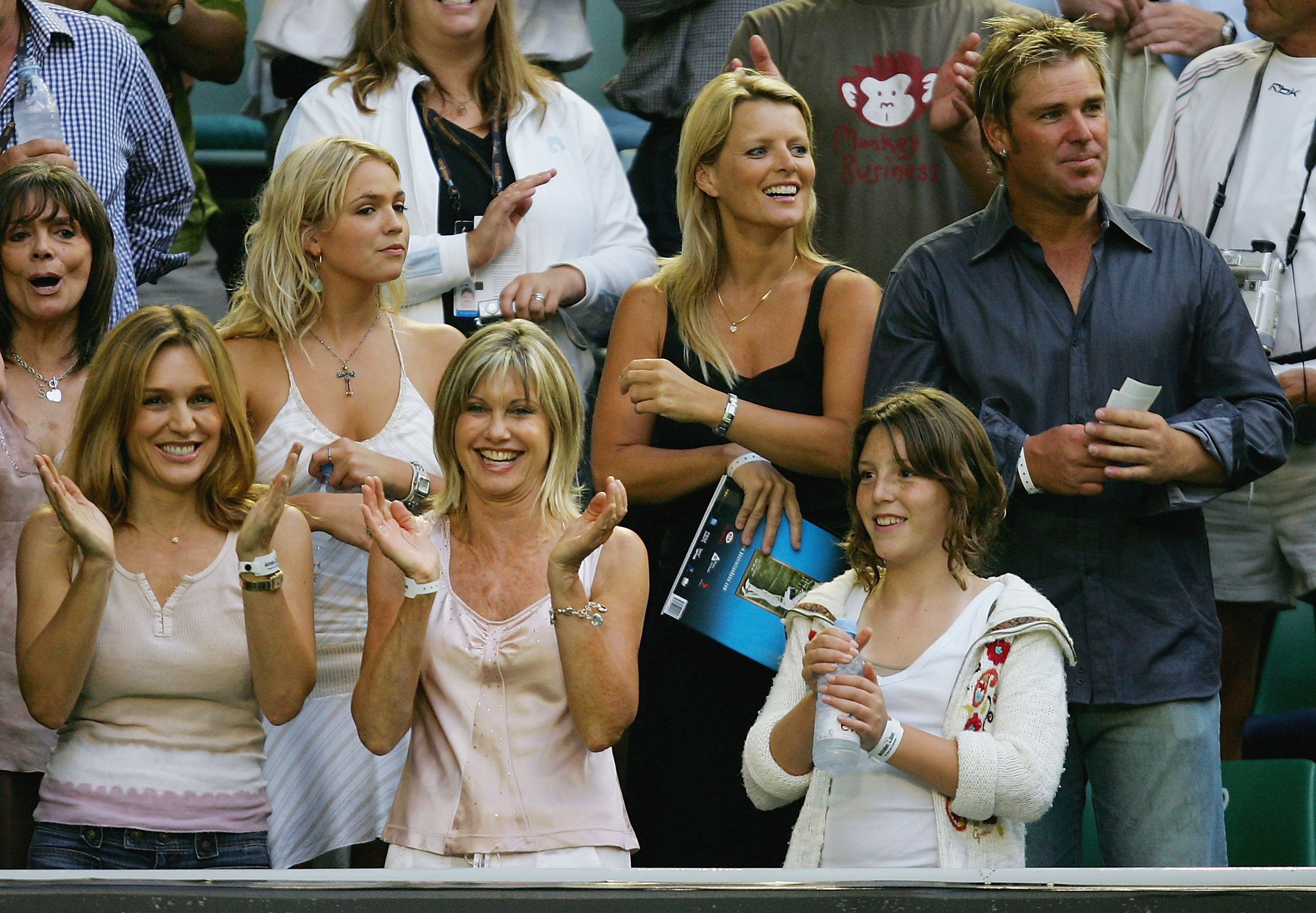 Tottie Goldsmith, Stephanie McIntosh, Olivia Newton-John, Simone Warne and husband cricketer Shane Warne watch the match between Lleyton Hewitt and Andy Roddick during day 12 of the Australian Open Grand Slam at Melbourne Park January 28, 2005 in Melbourne, Australia.  