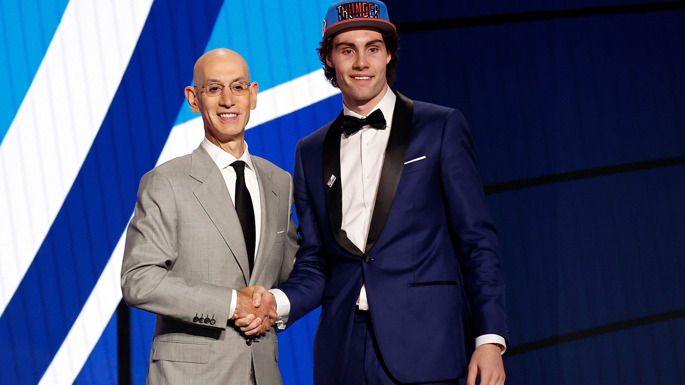 NBA commissioner Adam Silver (L) and Josh Giddey pose for photos after Giddey was drafted by the Oklahoma City Thunder during the 2021 NBA Draft at the Barclays Center on July 29, 2021 in New York City. (Photo by Arturo Holmes/Getty Images)