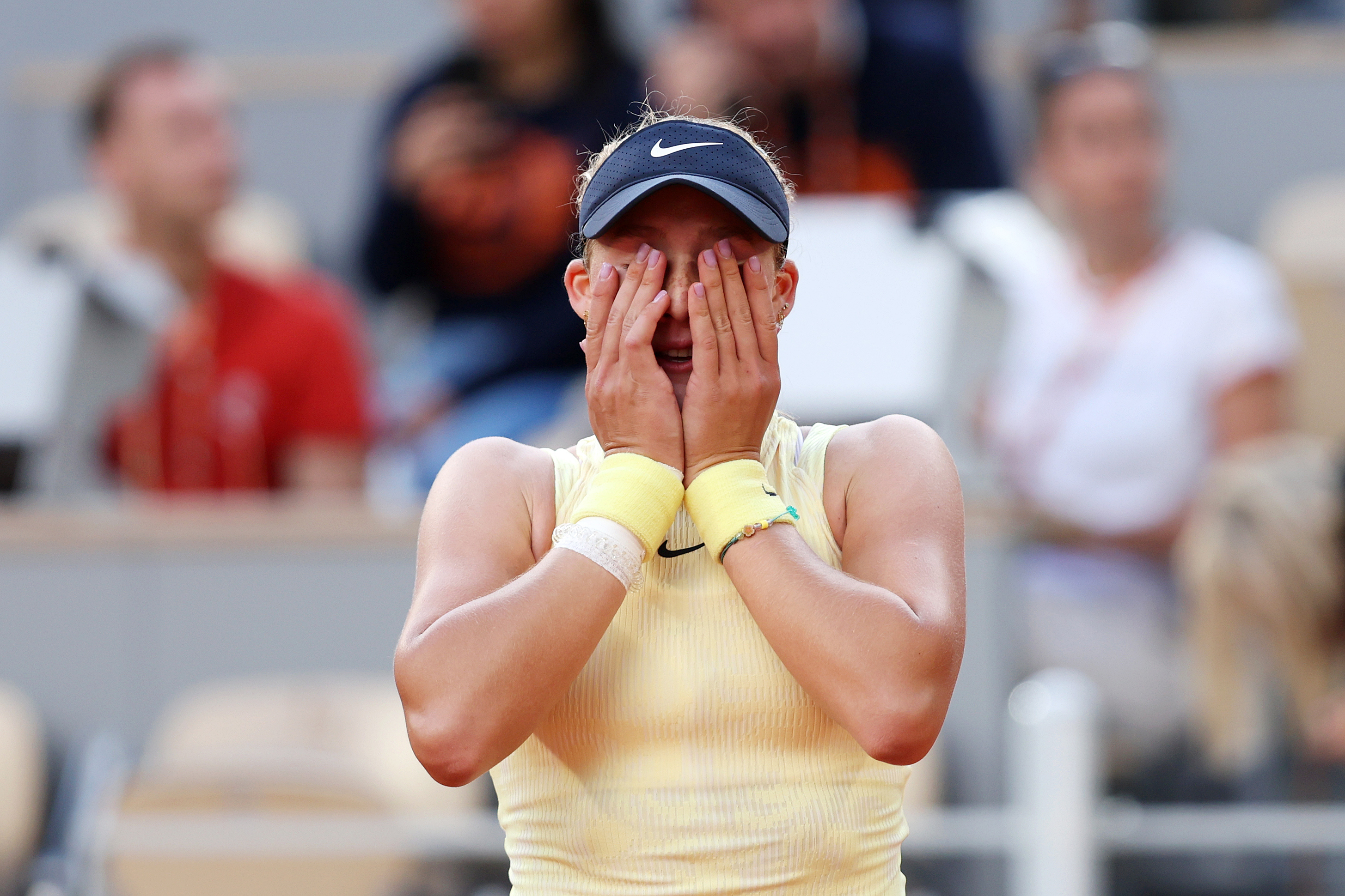 Mirra Andreeva reacts after winning match point against Aryna Sabalenka.