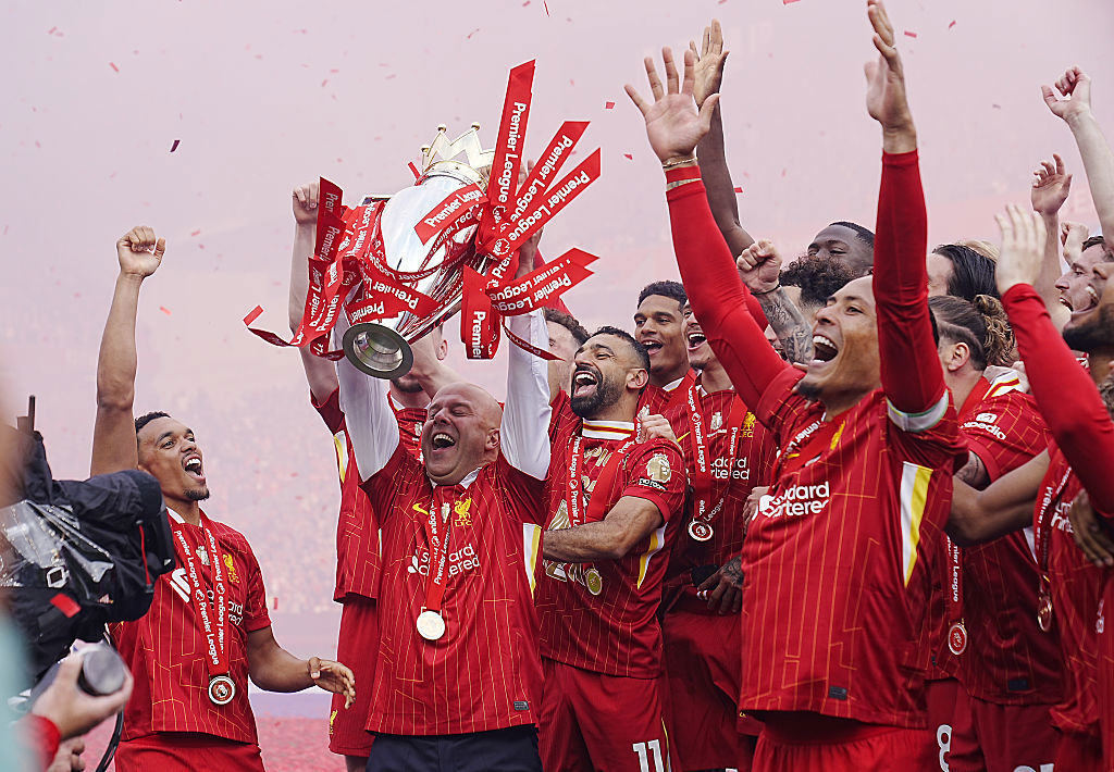 Liverpool manager Arne Slot lifts the Premier League trophy with the players.