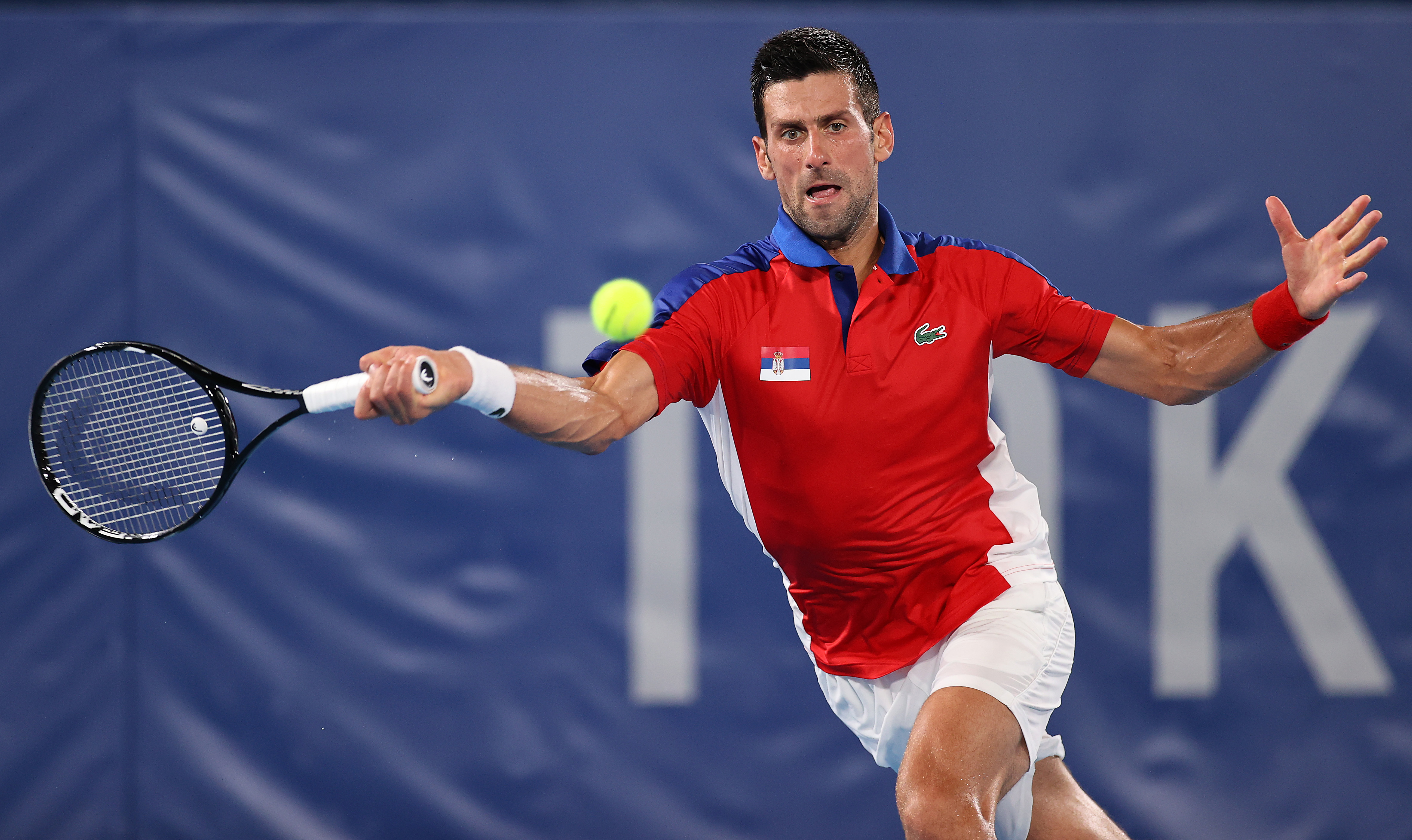 Djokovic of Team Serbia plays a forehand during his Men’s Singles Quarterfi...
