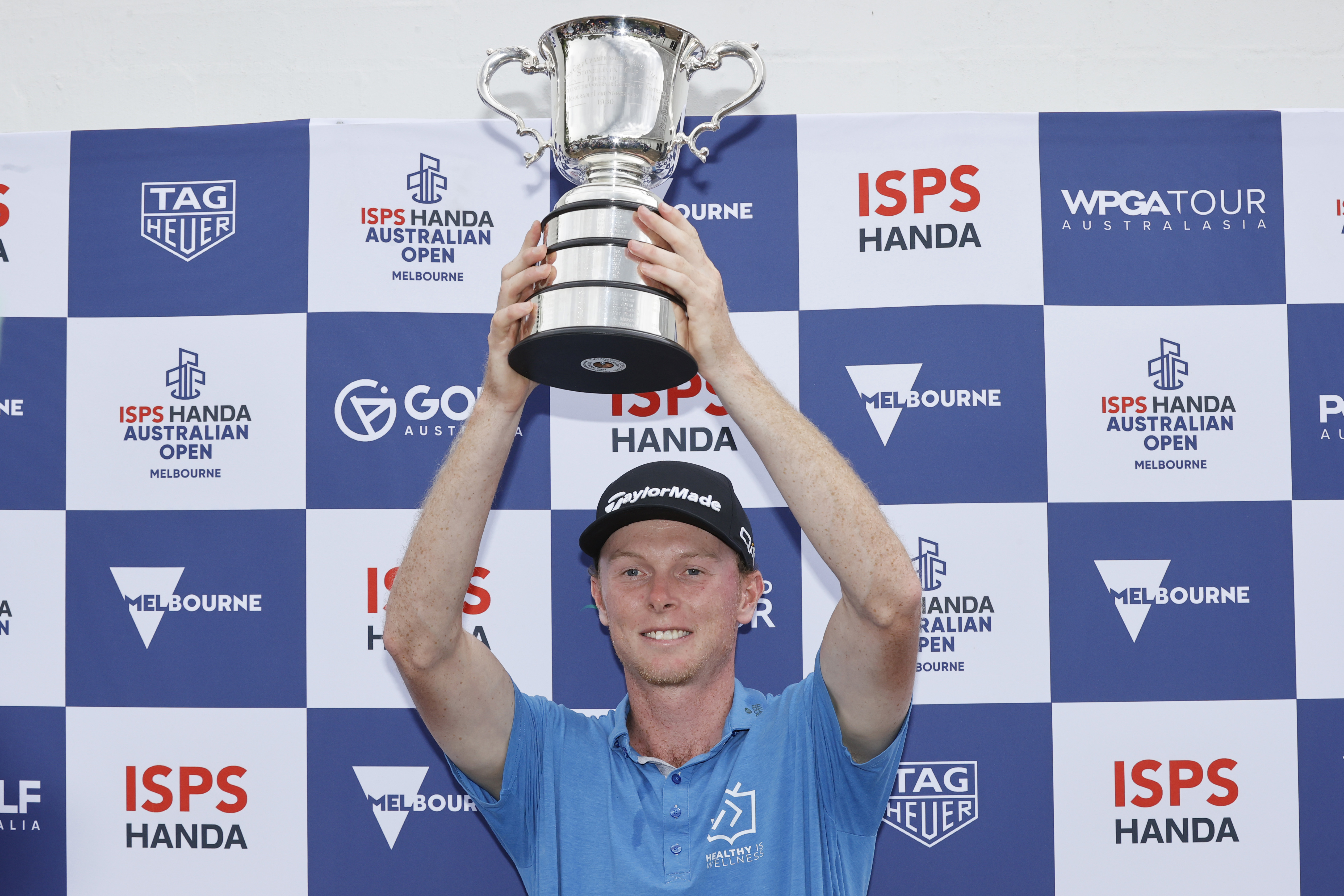 Ryggs Johnston poses with the Stonehaven Cup after victory on day four of the Australian Open 2024.