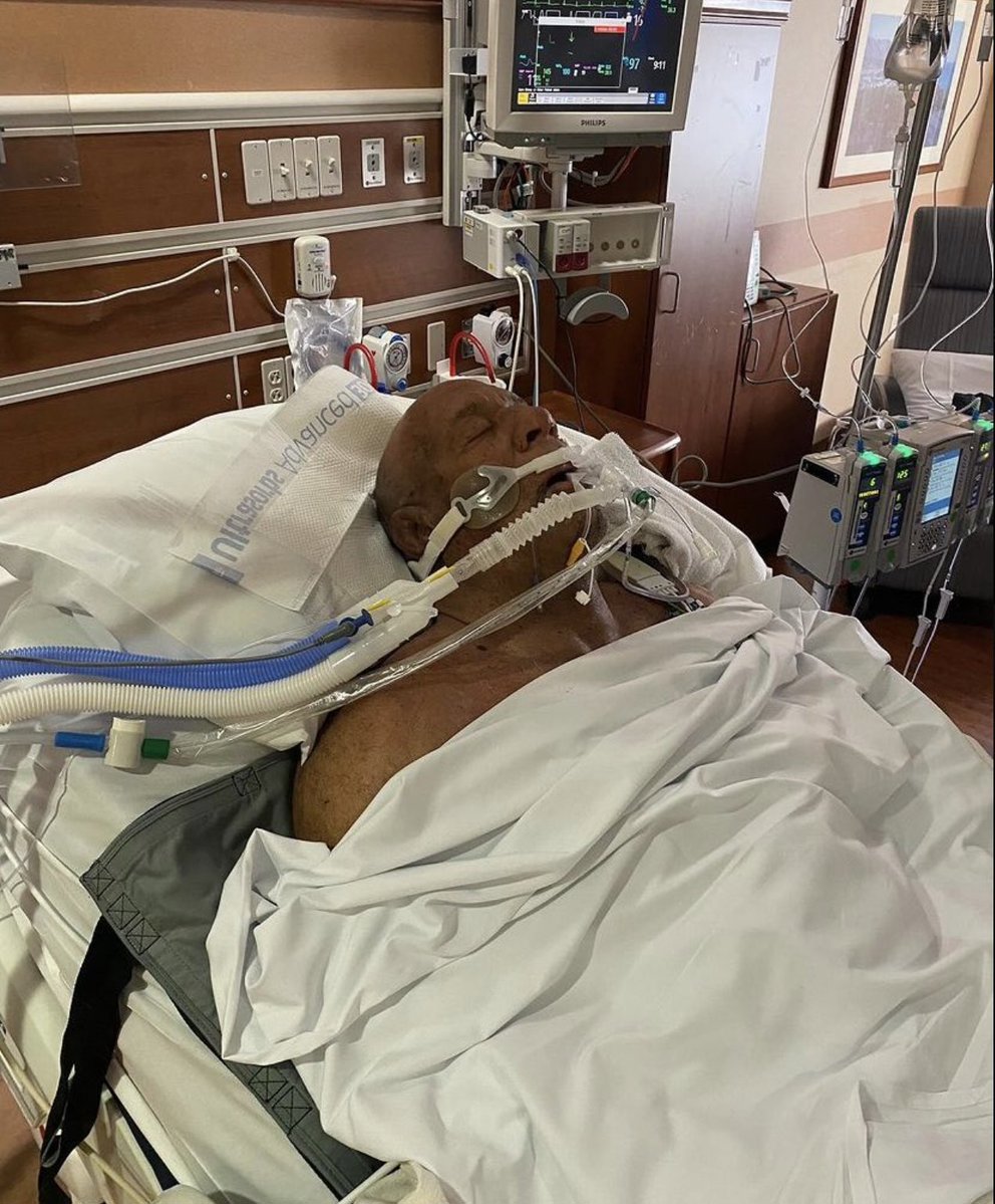 Mark Coleman in hospital after saving his parents from a terrifying house fire.