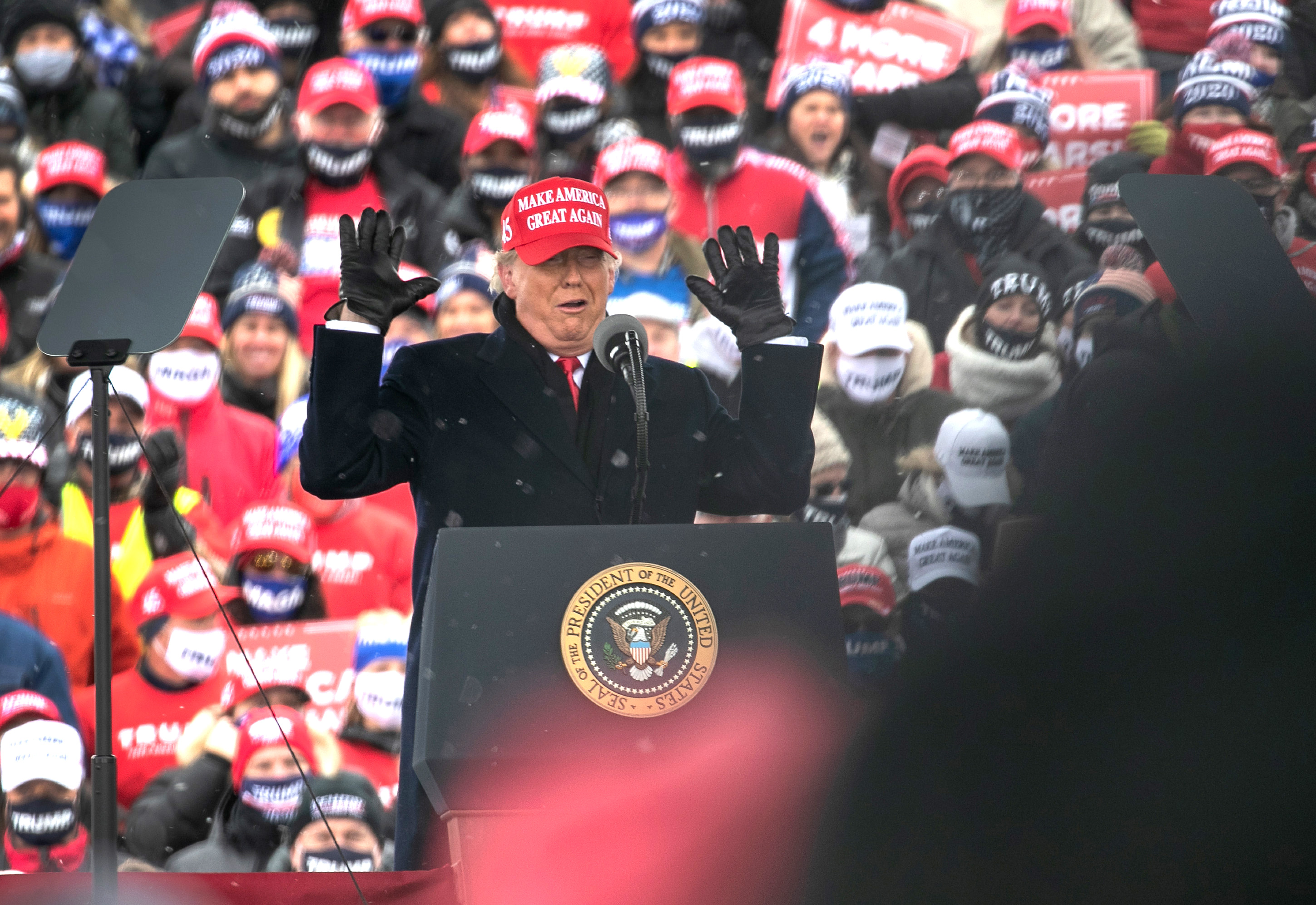 President Donald Trump addresses supporters at a campaign rally in Washington, Michigan.