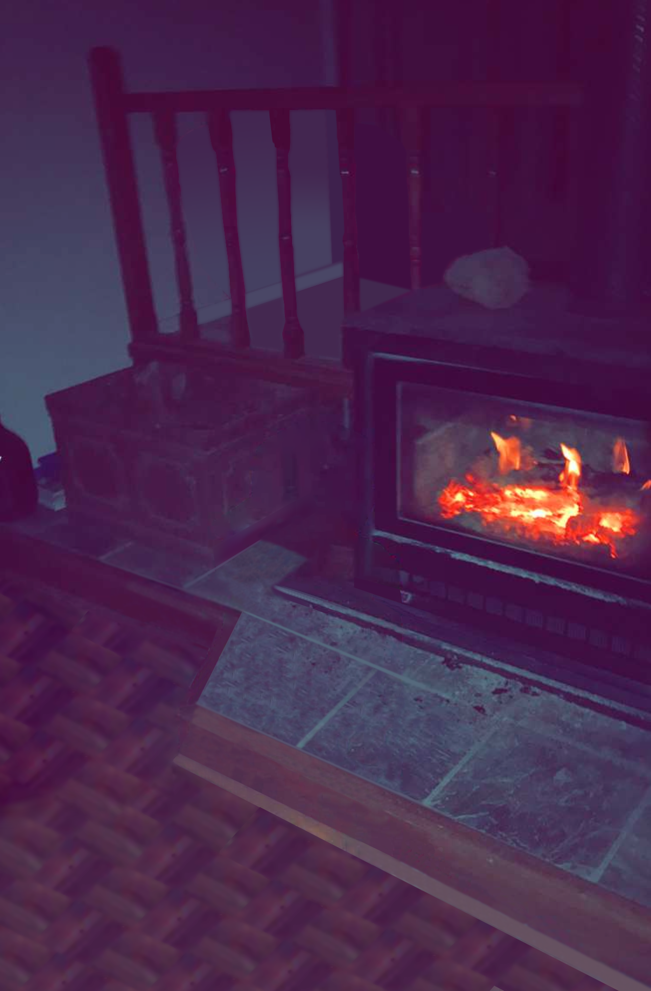A blurry image of a fireplace that is lit