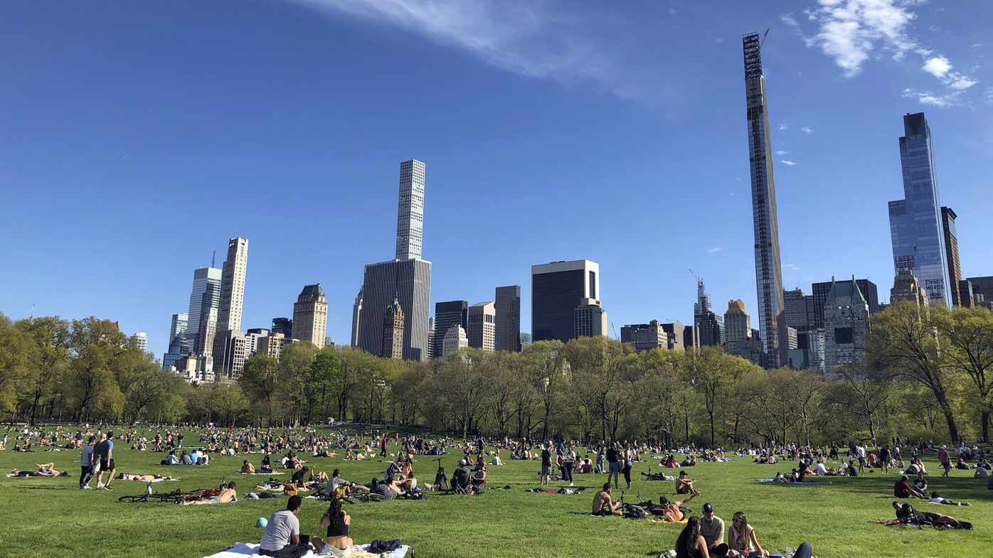 People practice social distancing while enjoying the nice weather at Central Park's Sheep Meadow, Saturday, May 2, 2020, in New York. 