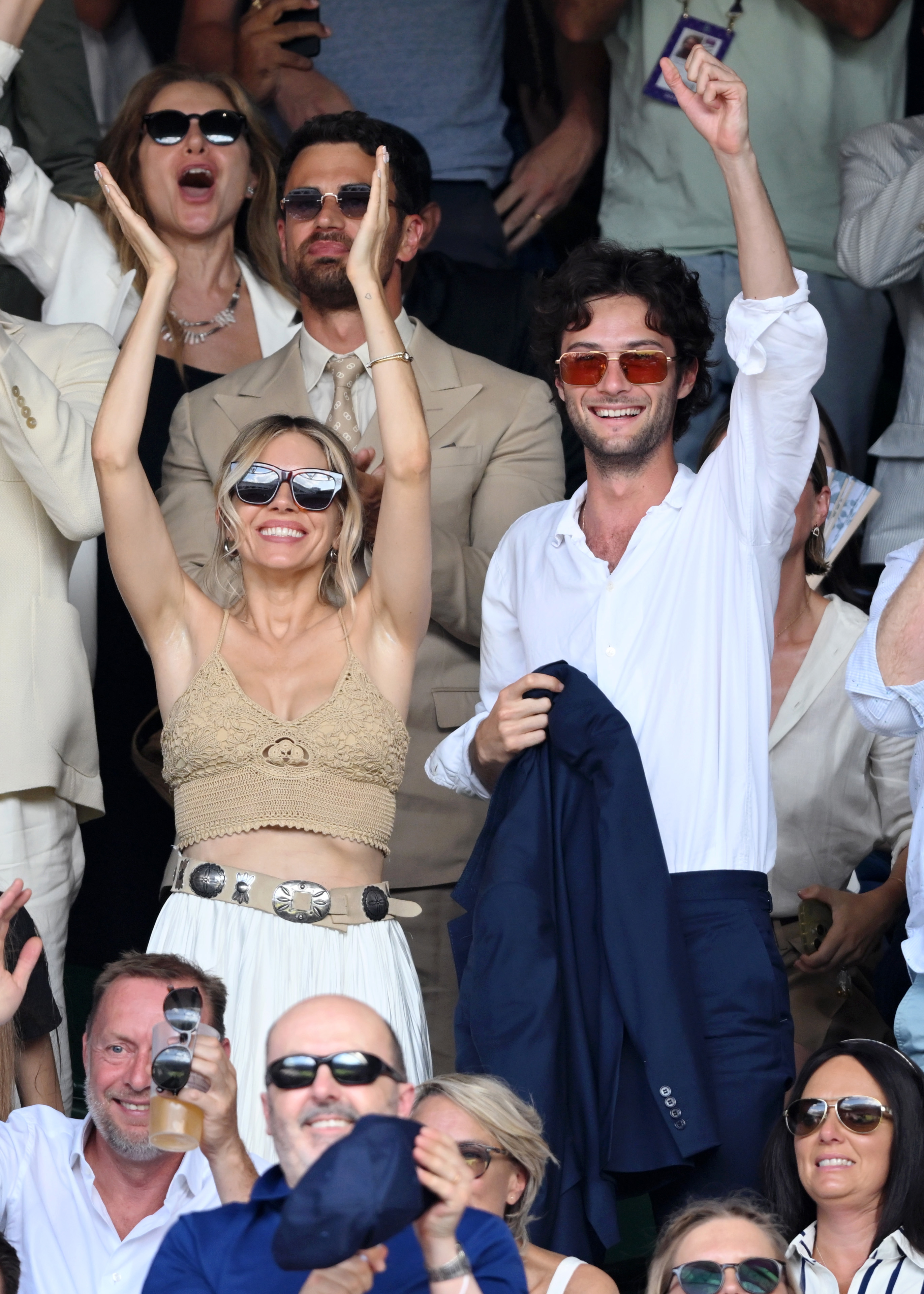 Sienna Miller and Oli Green on day 14 of the Wimbledon Tennis Championships at the All England Trennis and Croquet Club at on July 13, 2025 in London, England.
