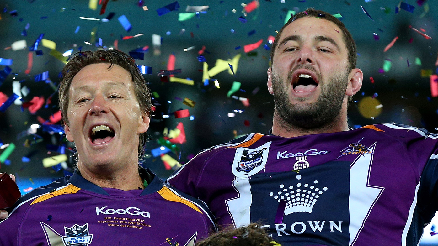 Jaiman Lowe with Craig Bellamy after Melbourne's 2012 grand final win.