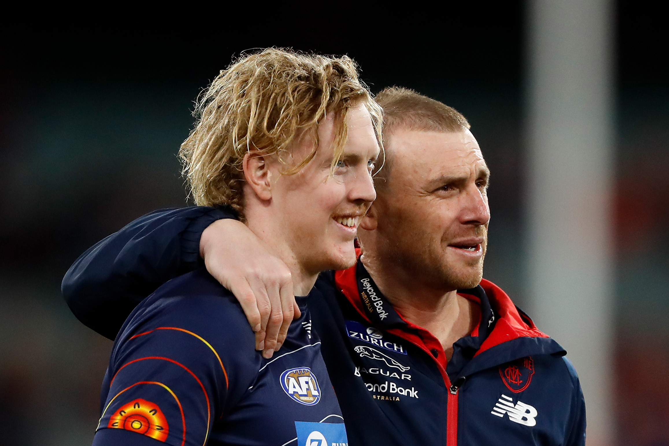 MELBOURNE, AUSTRALIA - SEPTEMBER 09: Clayton Oliver of the Demons and Simon Goodwin, Senior Coach of the Demons are seen during the 2022 AFL Second Semi Final match between the Melbourne Demons and the Brisbane Lions at the Melbourne Cricket Ground on September 9, 2022 in Melbourne, Australia. (Photo by Dylan Burns/AFL Photos)