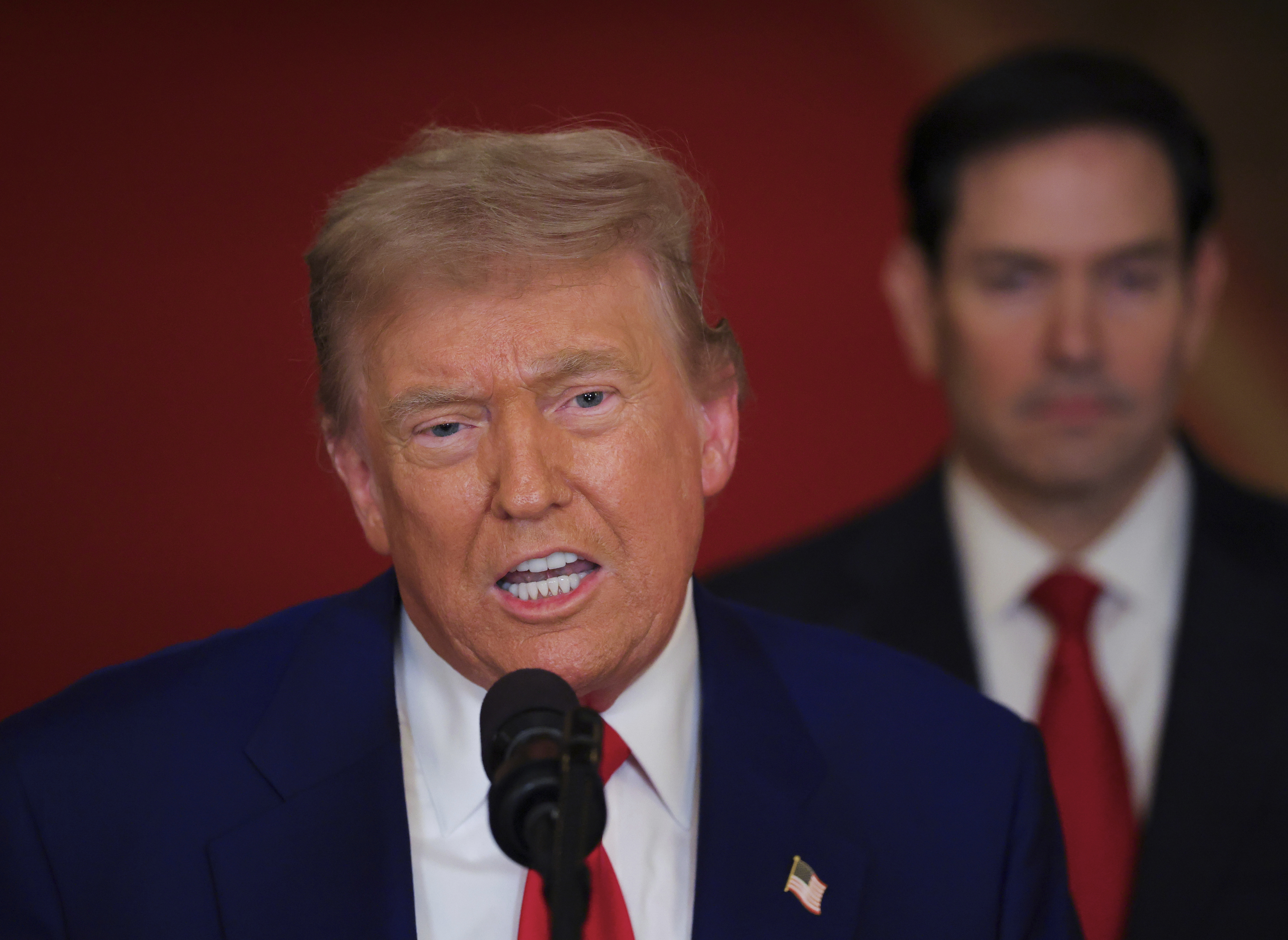 President Donald Trump speaks from the East Room of the White House in Washington, Saturday, June 21, 2025, after the U.S. military struck three Iranian nuclear and military sites, directly joining Israel's effort to decapitate the country's nuclear program, as Secretary of State Marco Rubio listens. (Carlos Barria/Pool via AP)