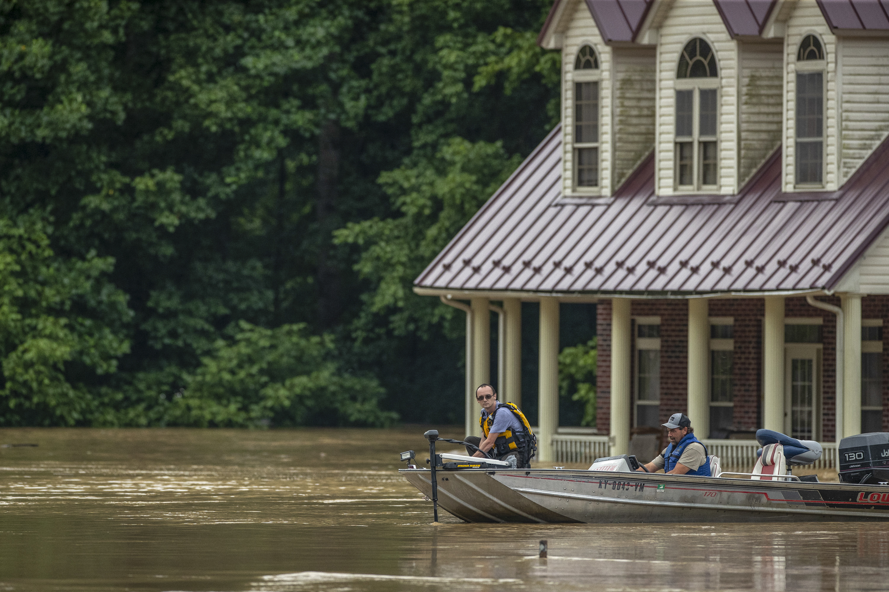 Homes are flooded by Lost Creek, Ky., on Thursday, July 28, 2022. Heavy rains have caused flash flooding and mudslides as storms pound parts of central Appalachia. Kentucky Gov. Andy Beshear says it's some of the worst flooding in state history. (Ryan C. Hermens/Lexington Herald-Leader via AP)