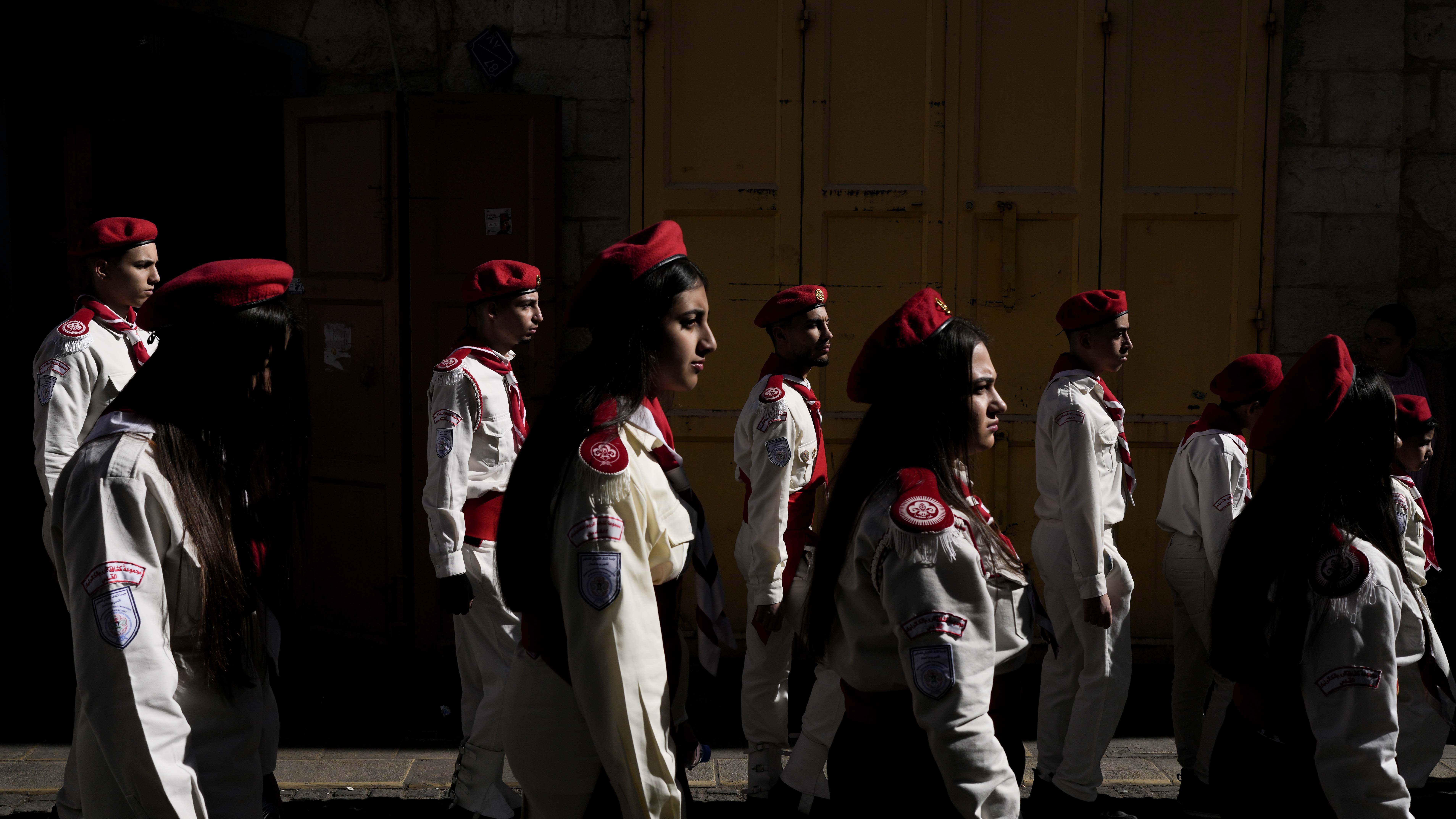 Scouts line up during the traditional Christian procession towards the Church of the Nativity, traditionally believed to be the birthplace of Jesus, on Christmas Eve, in the West Bank city of Bethlehem, Tuesday, Dec. 24, 2024. (AP Photo/Matias Delacroix)