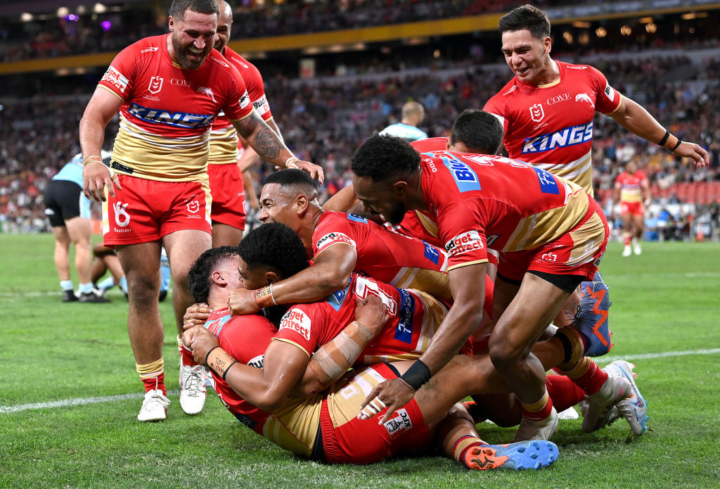 Valynce Te Whare celebrates with team mates after scoring a try.