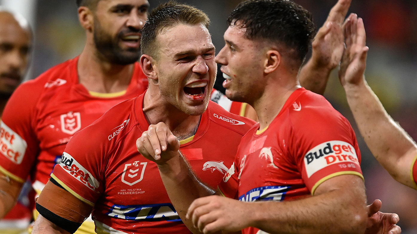 Dolphins players Euan Aitken and Jake Averillo celebrate a try against the Cowboys.