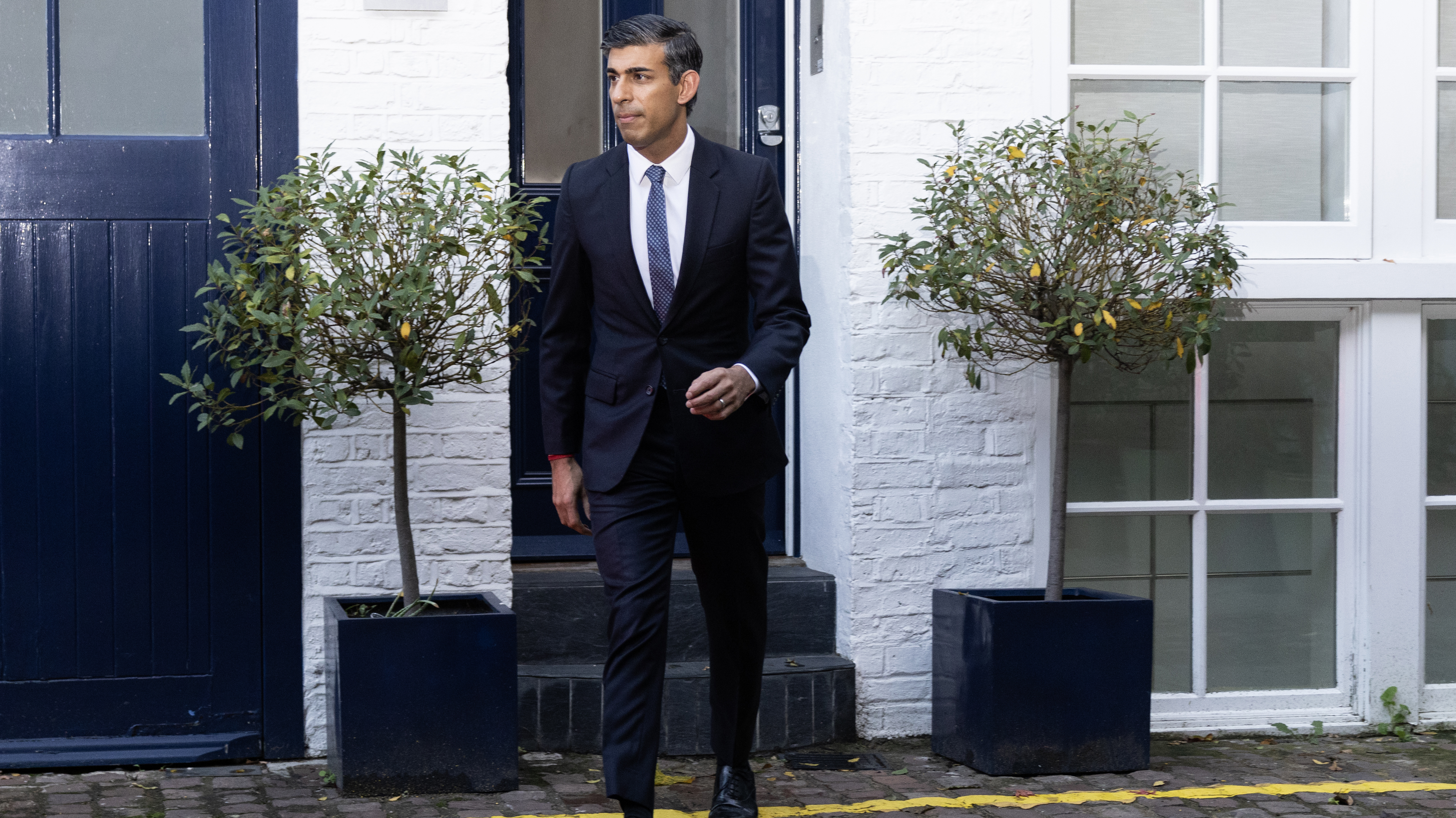 Rishi Sunak leaves his home in London.