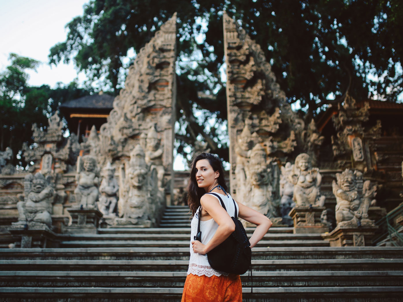 Young woman on holiday in Bali, visiting temples
