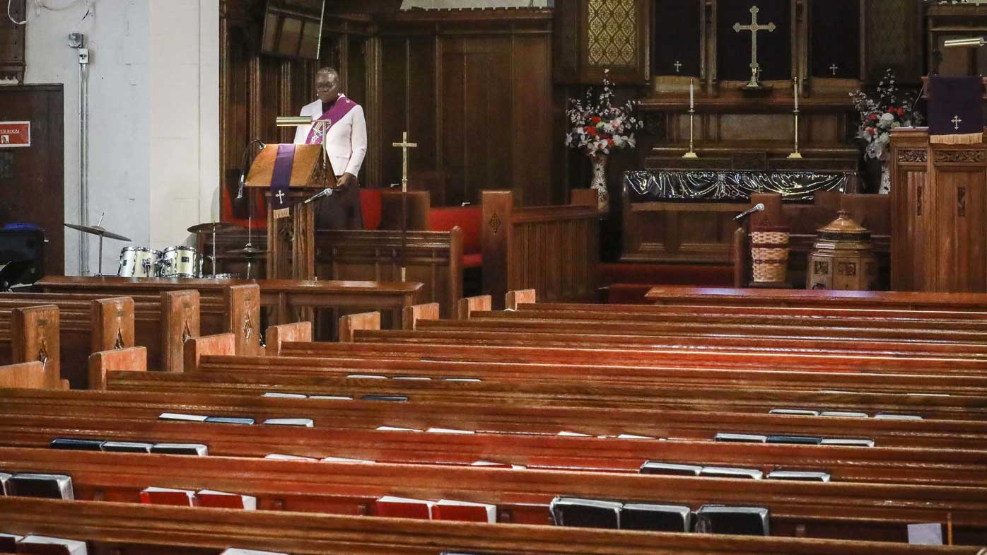 Reverend Janet Cox, a deacon at St. Paul's Methodist Church in Brooklyn, New York, delivers her sermon from an empty church to home-bound congregants by a livestream broadcast.