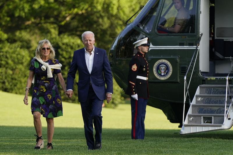 President Joe Biden and first lady Jill Biden walk on the South Lawn of the White House after stepping off Marine One on June 27 in Washington. 