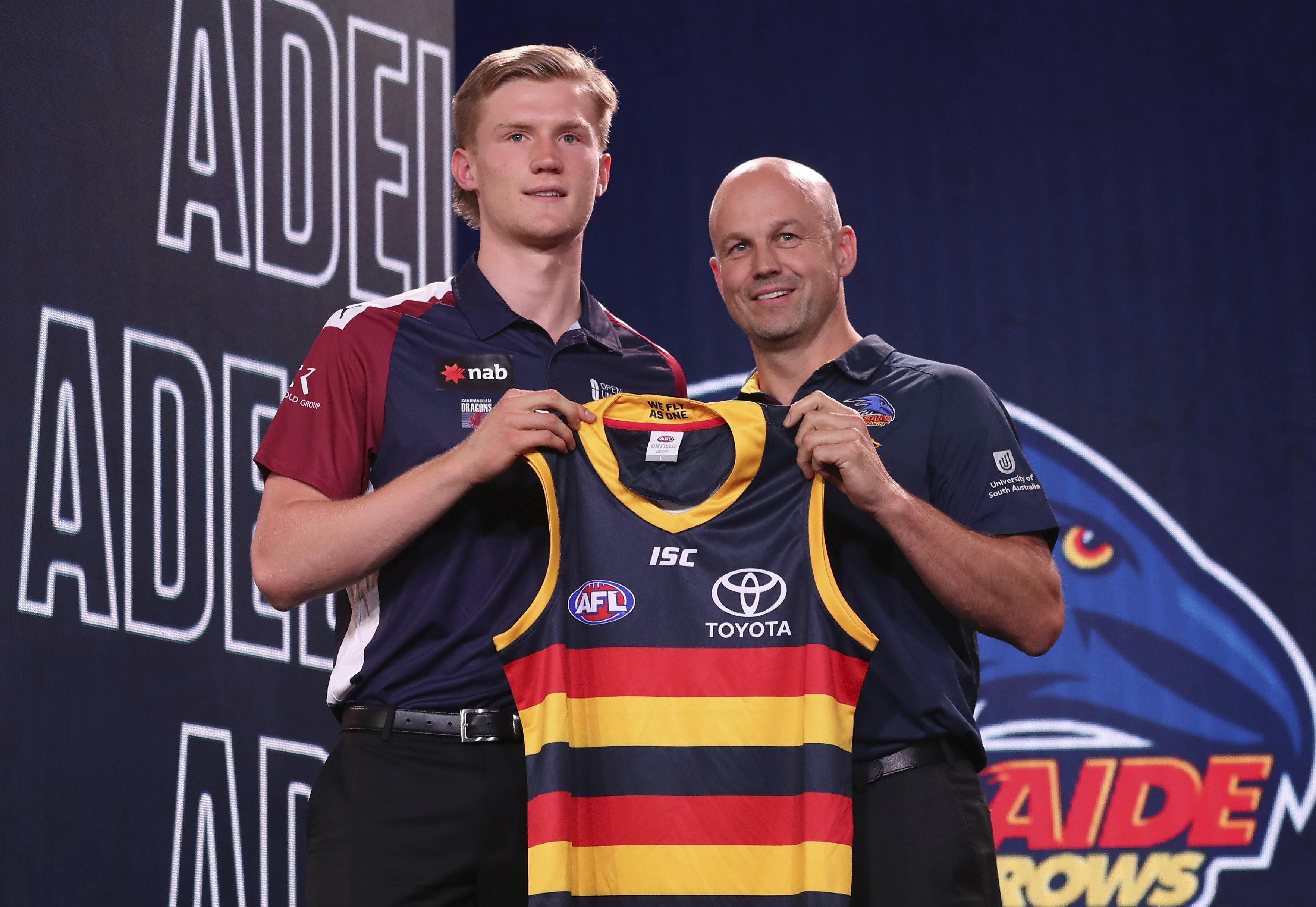 Fischer McAsey poses with Adelaide Crows coach Matthew Nicks during the 2019 AFL draft.