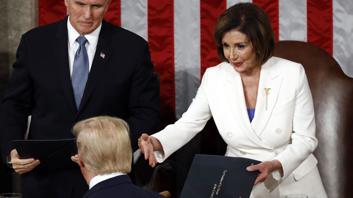 Nancy Pelosi offered her hand to Donald Trump, but he did not take it.