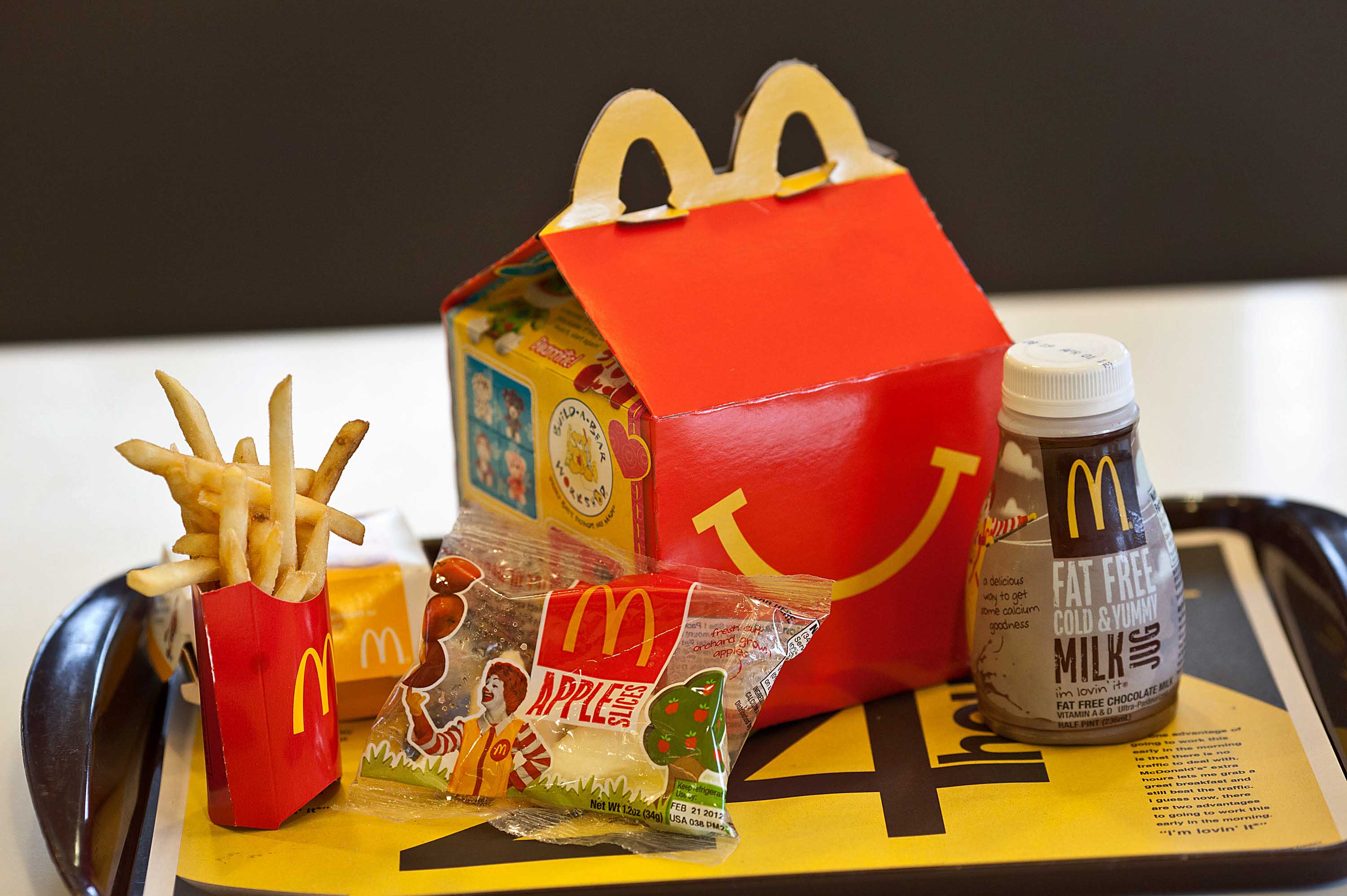 A Happy Meal is displayed for a photograph on a tray at a McDonald's Corp. restaurant in Little Falls, New Jersey, U.S., on Wednesday, Feb. 15, 2012. McDonald's Corp., the world's largest restaurant chain, said sales at stores open at least 13 months rose 6.7 percent globally last month as beverages and Chicken McBites helped the U.S. business. Photographer: Emile Wamsteker/Bloomberg via Getty Images