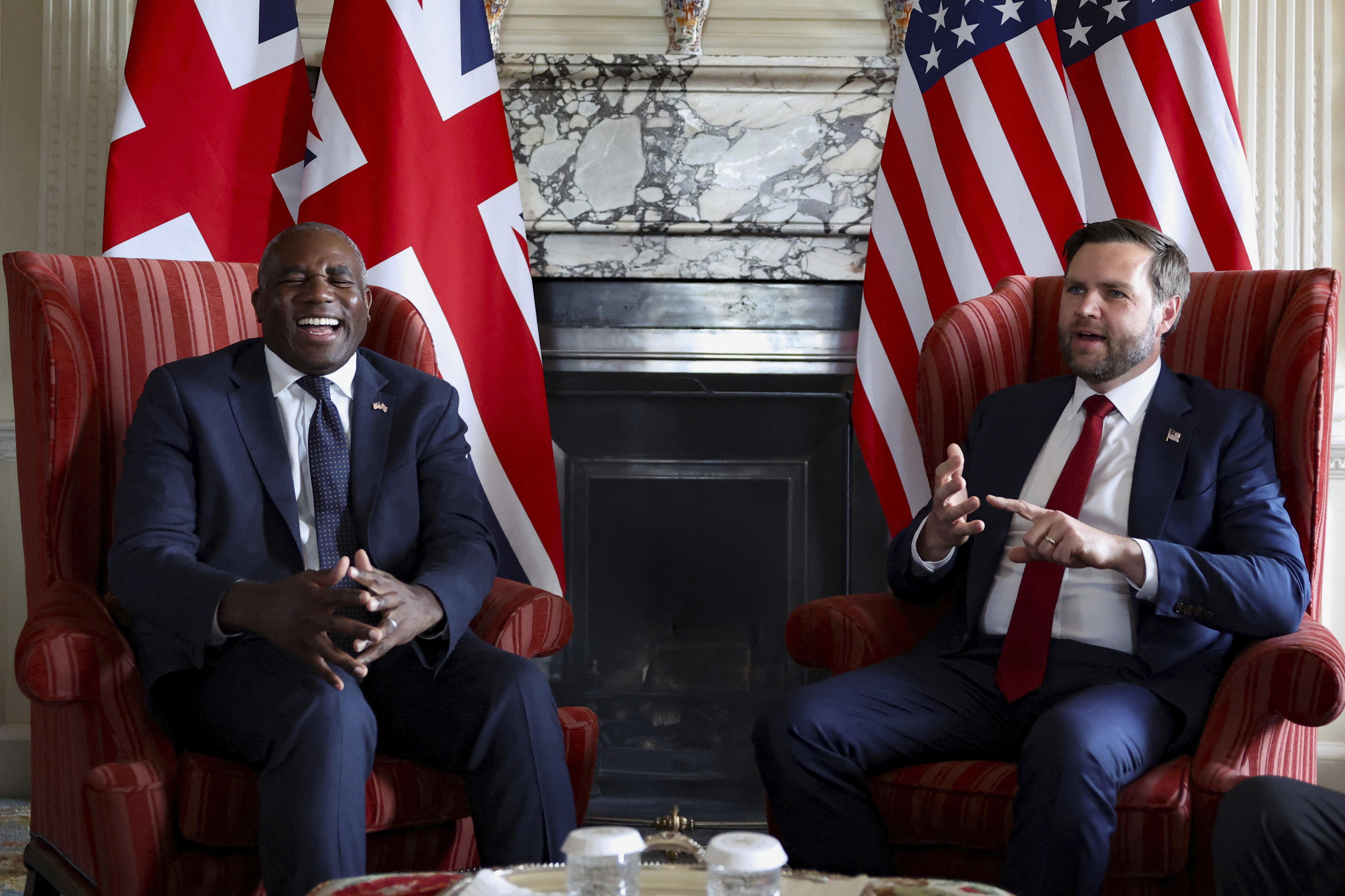 Britain's Foreign Secretary David Lammy, left, and US Vice President JD Vance during a meeting at Chevening House in Kent, England, Friday, Aug. 8, 2025. (Suzanne Plunkett/Pool via AP)