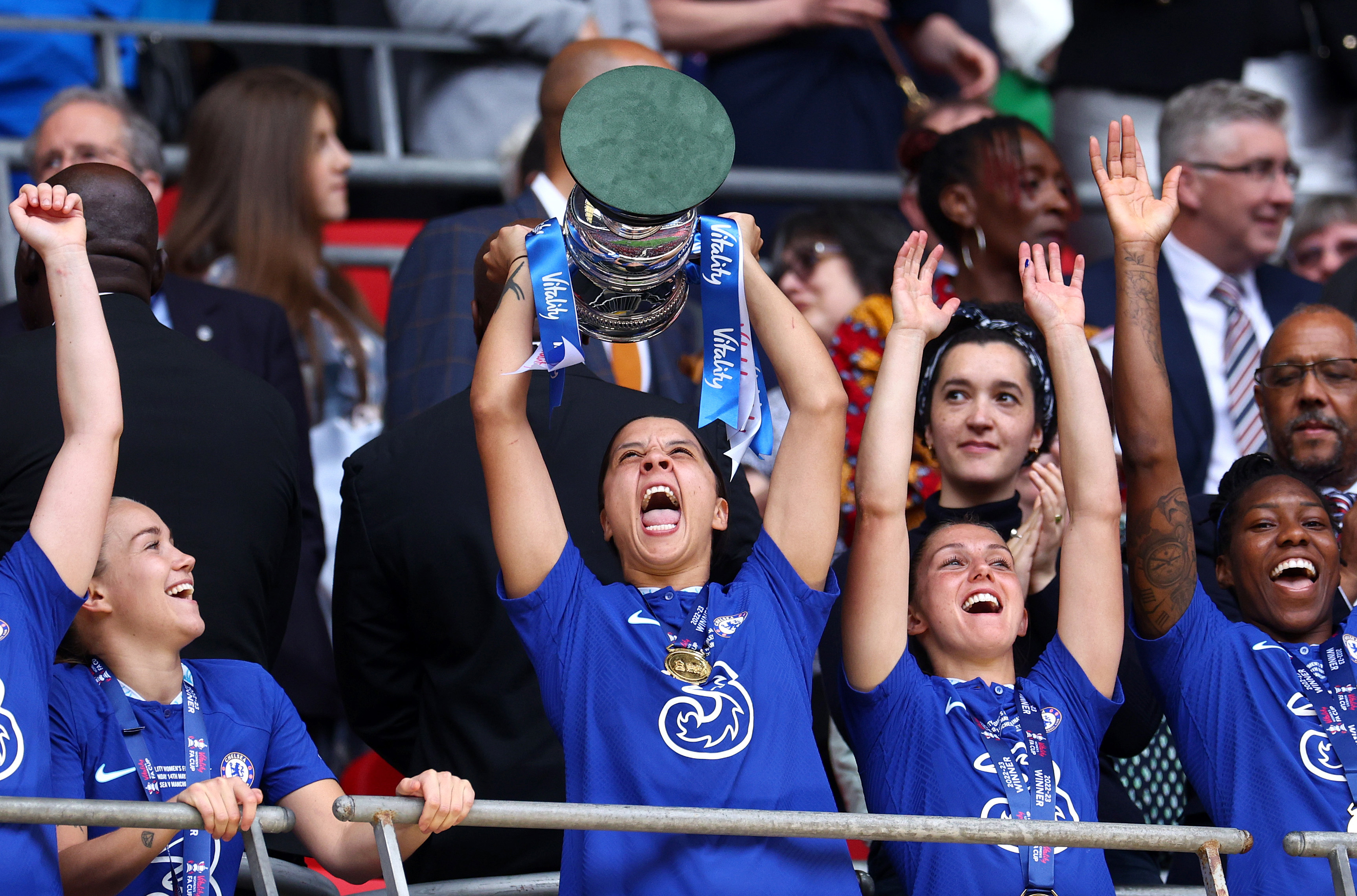 Sam Kerr of Chelsea lifts the FA Cup trophy after the team's victory.