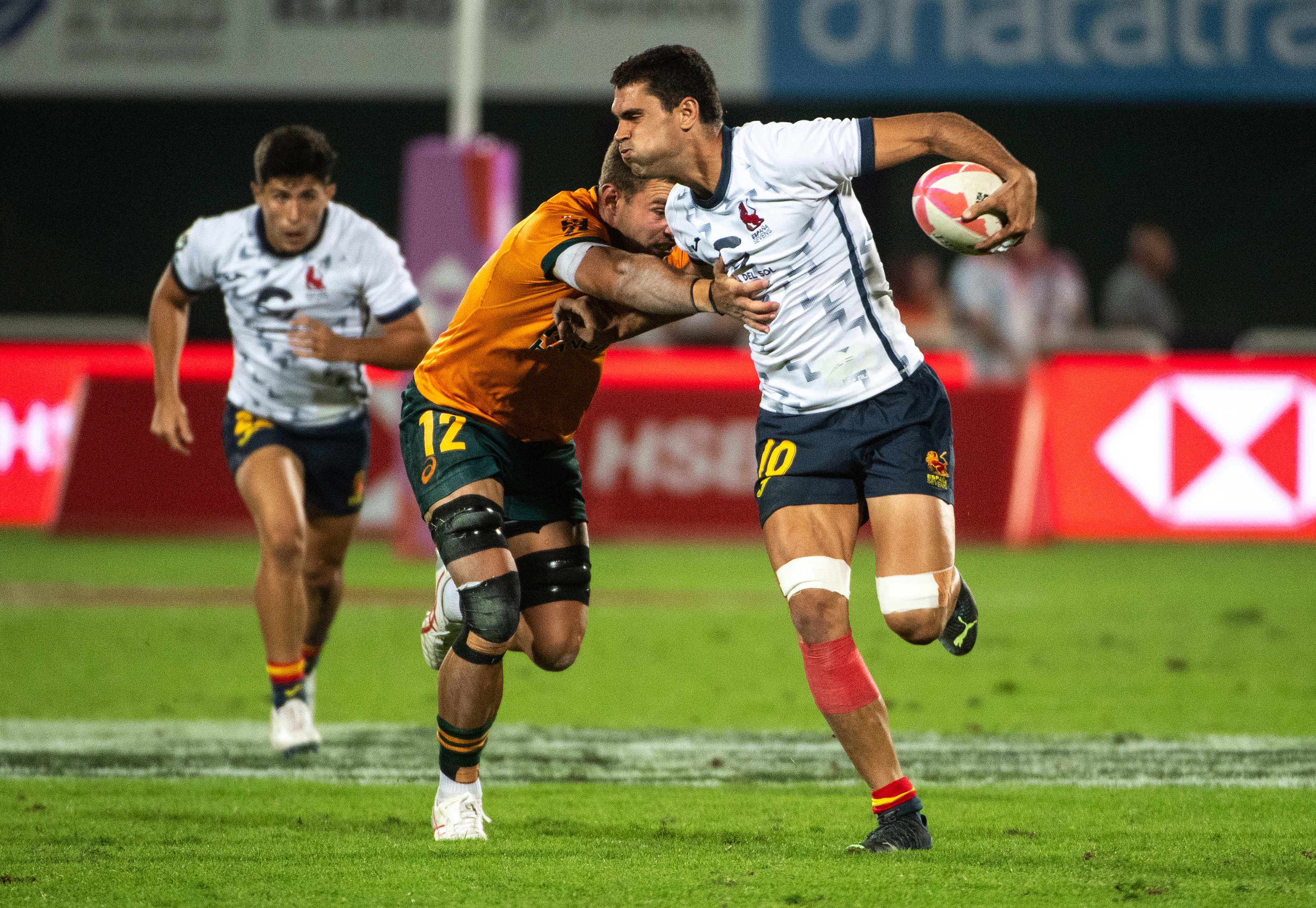 Nathan Lawson of Australia tackles Manu Moreno of Spain.