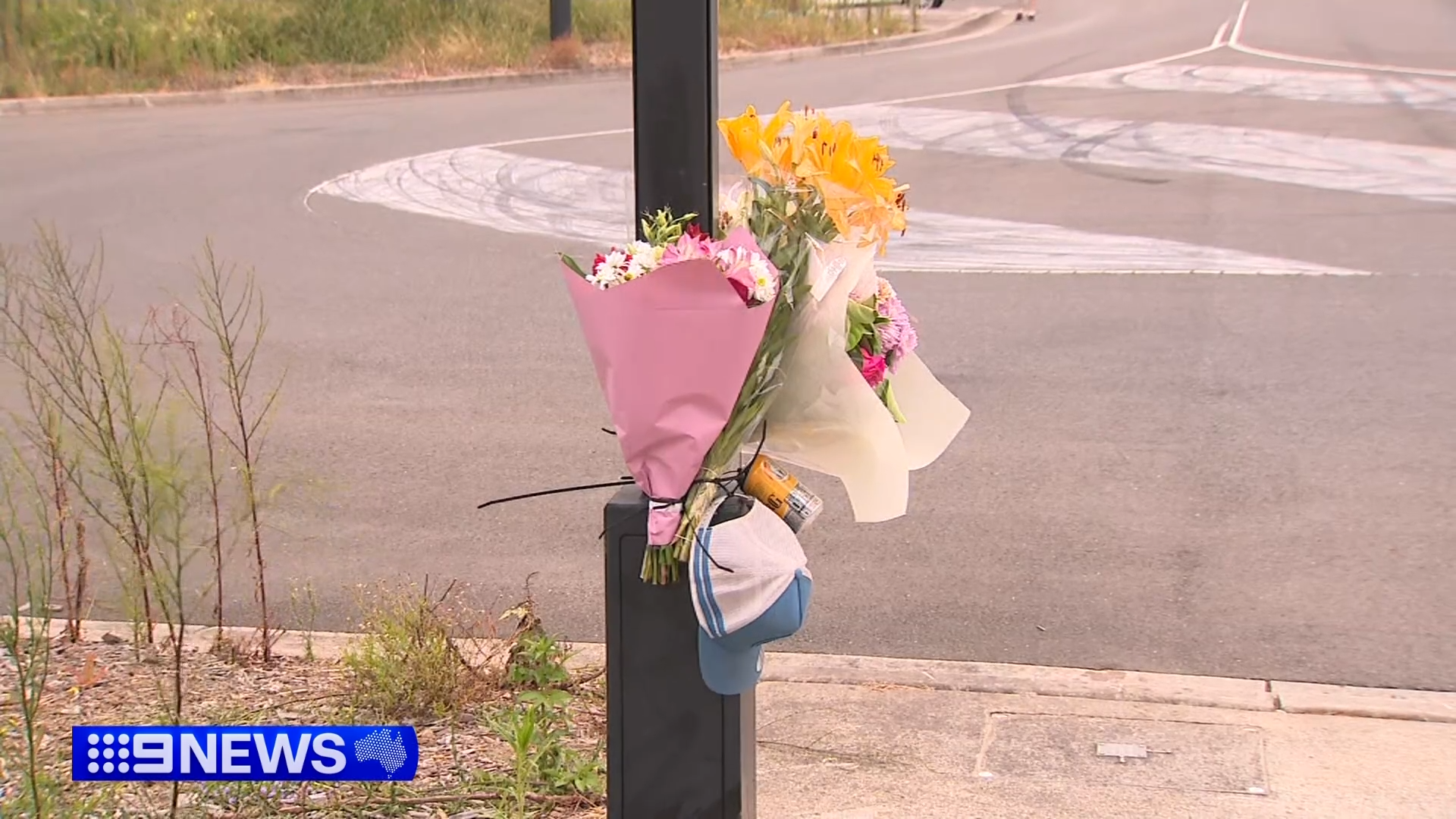 A hat and a can of Bundaberg rum were among the tributes. 