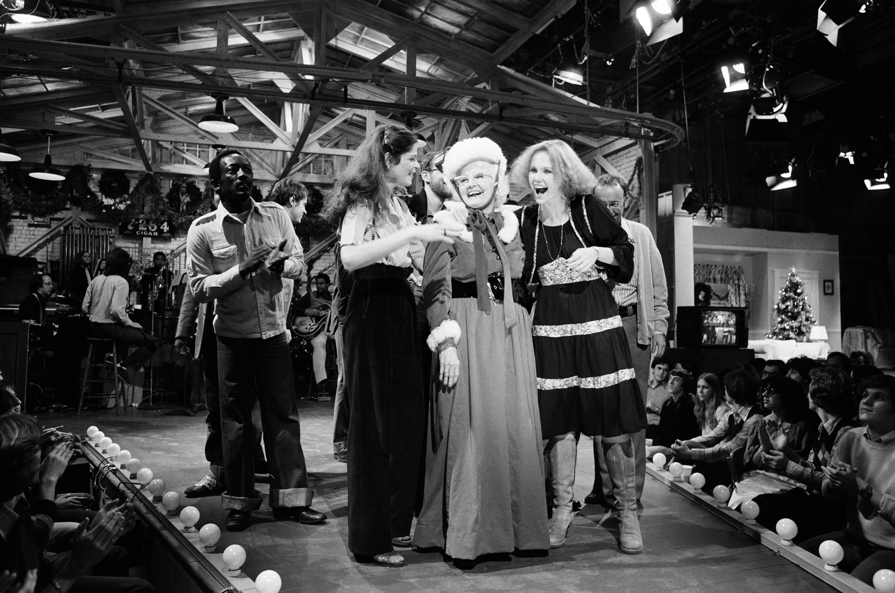 Miskel Spillman is seen on stage at "Saturday Night Live" on December 17, 1977, following her debut as host. Spillman, a then-80-year-old grandmother from New Orleans, won a contest that put her on one of television's biggest stages. She's pictured with Garrett Morris, Gilda Radner and granddaughter, Janine Baker.