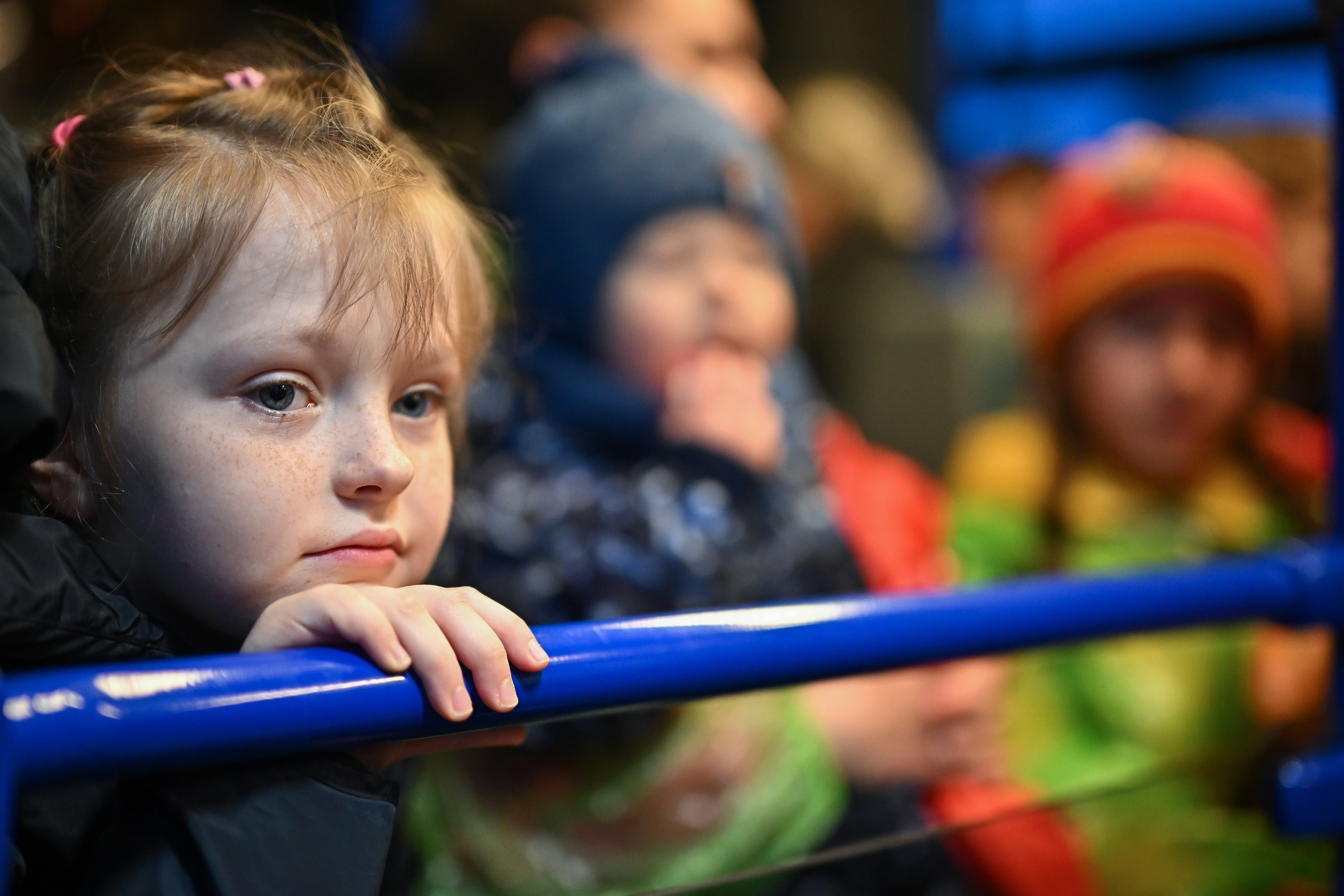 People, mainly women and children, make their way through Medyka border crossing during the evening after journeying from war-torn Ukraine on April 01, 2022 in Medyka, Poland. More than 4 million people have fled Ukraine since the Russian invasion of that country on Feb. 24. Millions more have been internally displaced. (Photo by Jeff J Mitchell/Getty Images)