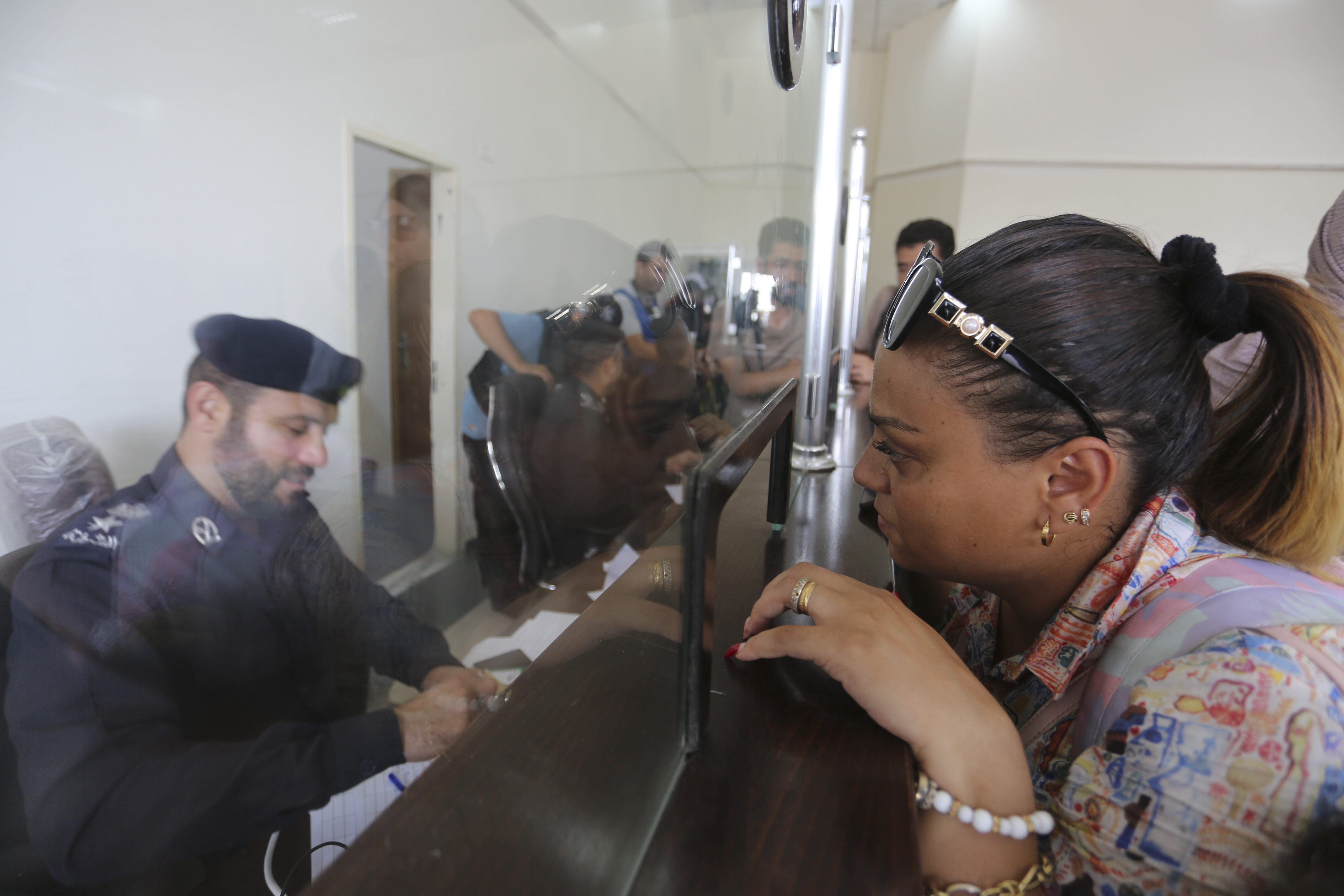 Palestinians with dual nationality register to cross to Egypt on the Gaza Strip side of the border crossing in Rafah on Thursday, Nov. 2, 2023. 