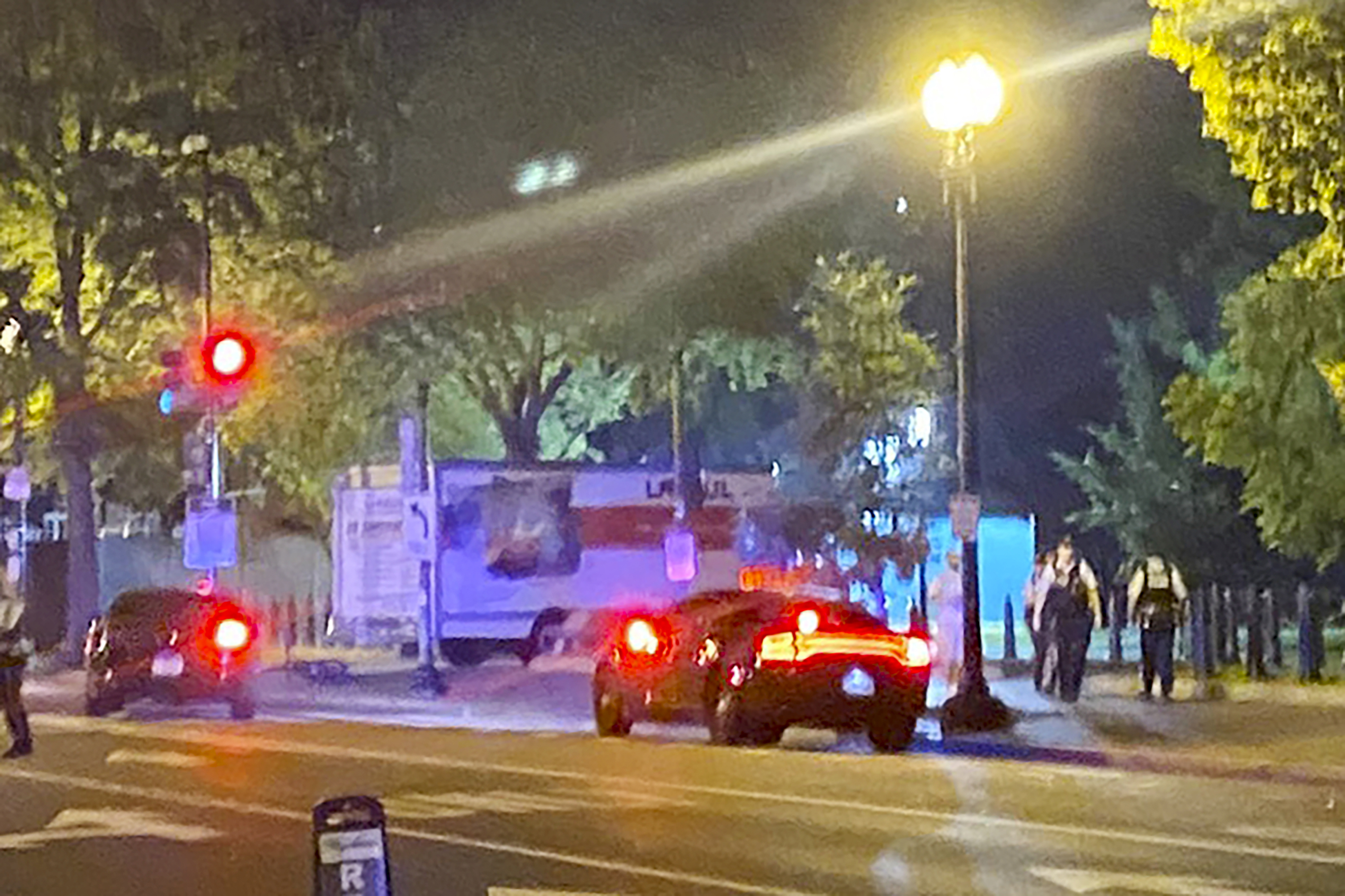 A box truck is seen crashed into a security barrier at a park across from the White House, Monday night, May 23, 2023 in Washington. 