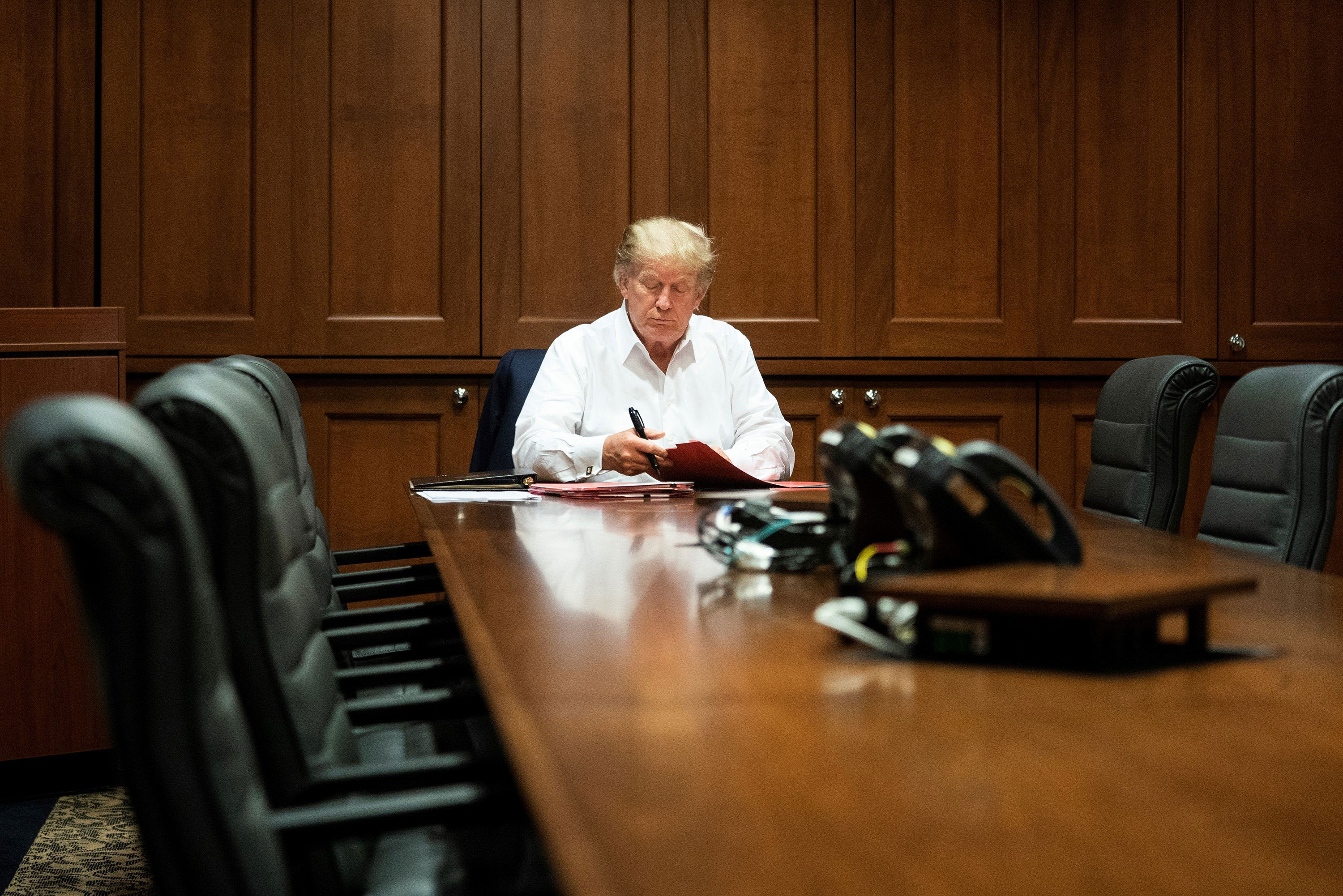 President Donald J. Trump works in his conference room at Walter Reed National Military Medical Center