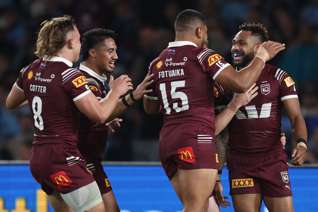 The Maroons celebrating a try.