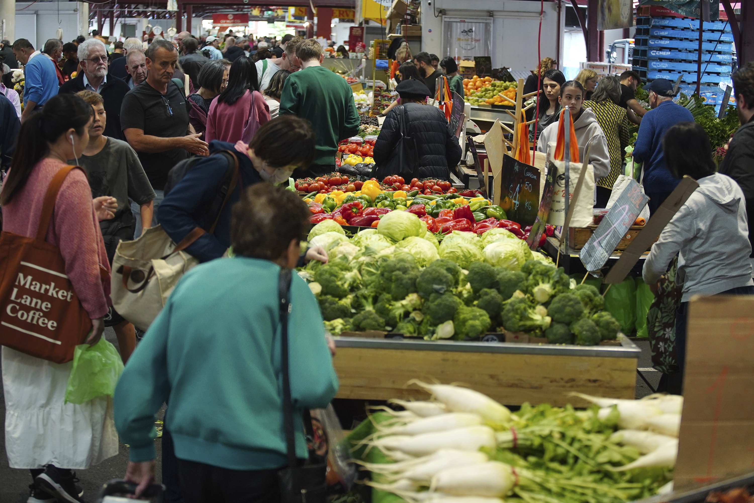 General photo of people shopping for fruits and vegetables at the Queen Vic Market on Friday 2, December 2023. inflation consumer economy