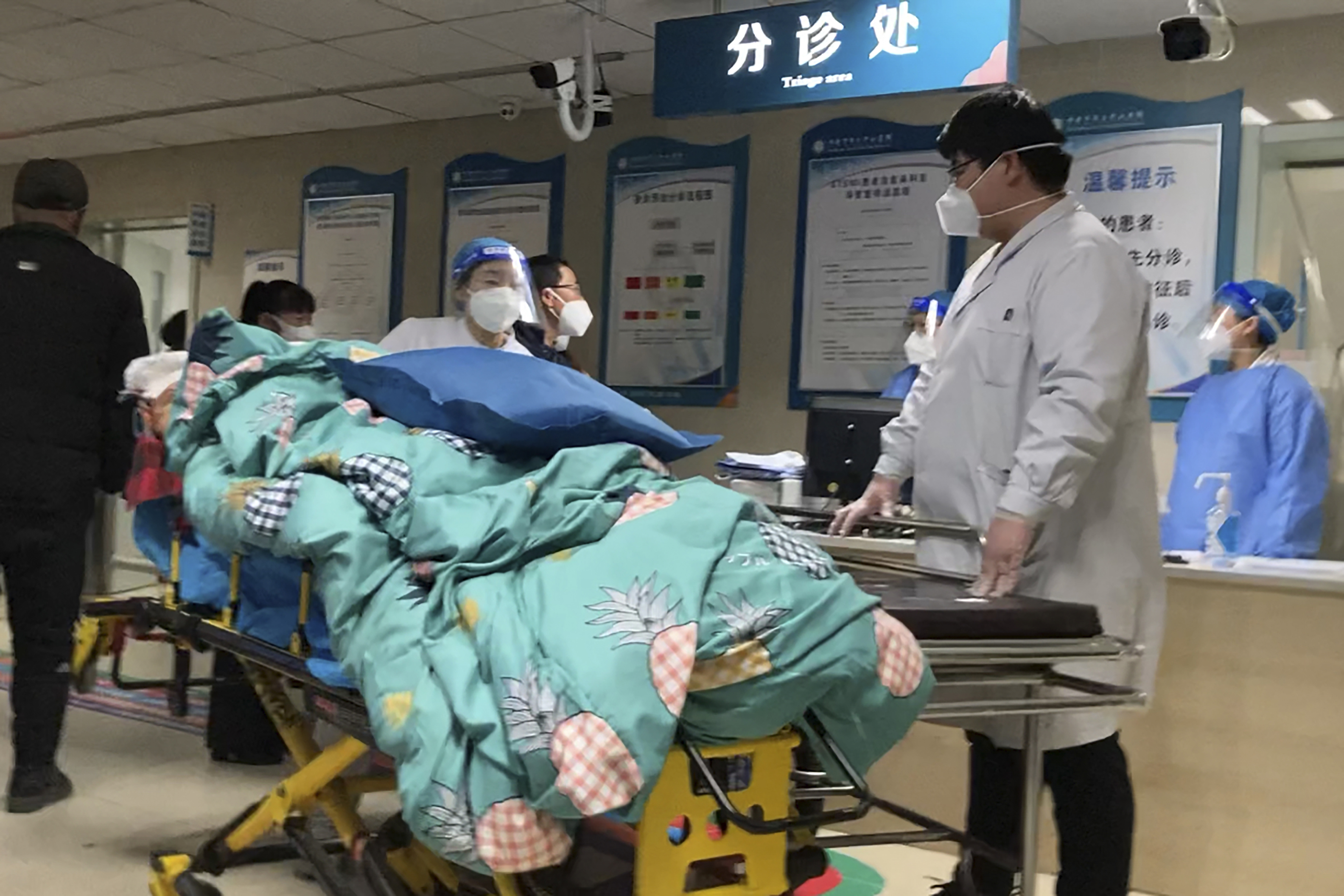 A patient is turned away from the emergency room due to full capacity at the Baoding No. 2 Central Hospital in Zhuozhou city in northern China's Hebei province on Wednesday, December 21, 2022. 