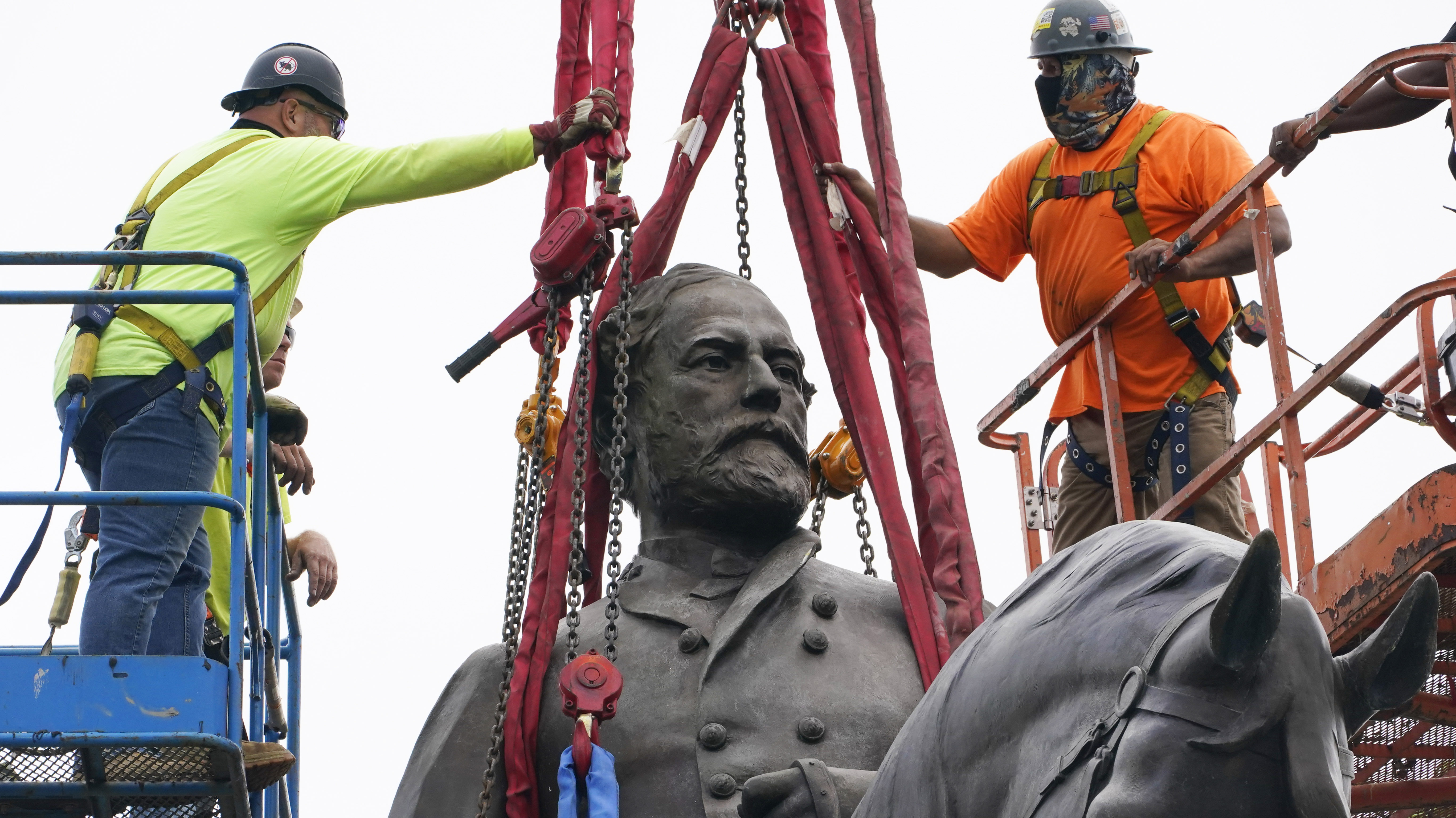 Crews worked to remove one of the country's largest remaining monuments to the Confederacy. 