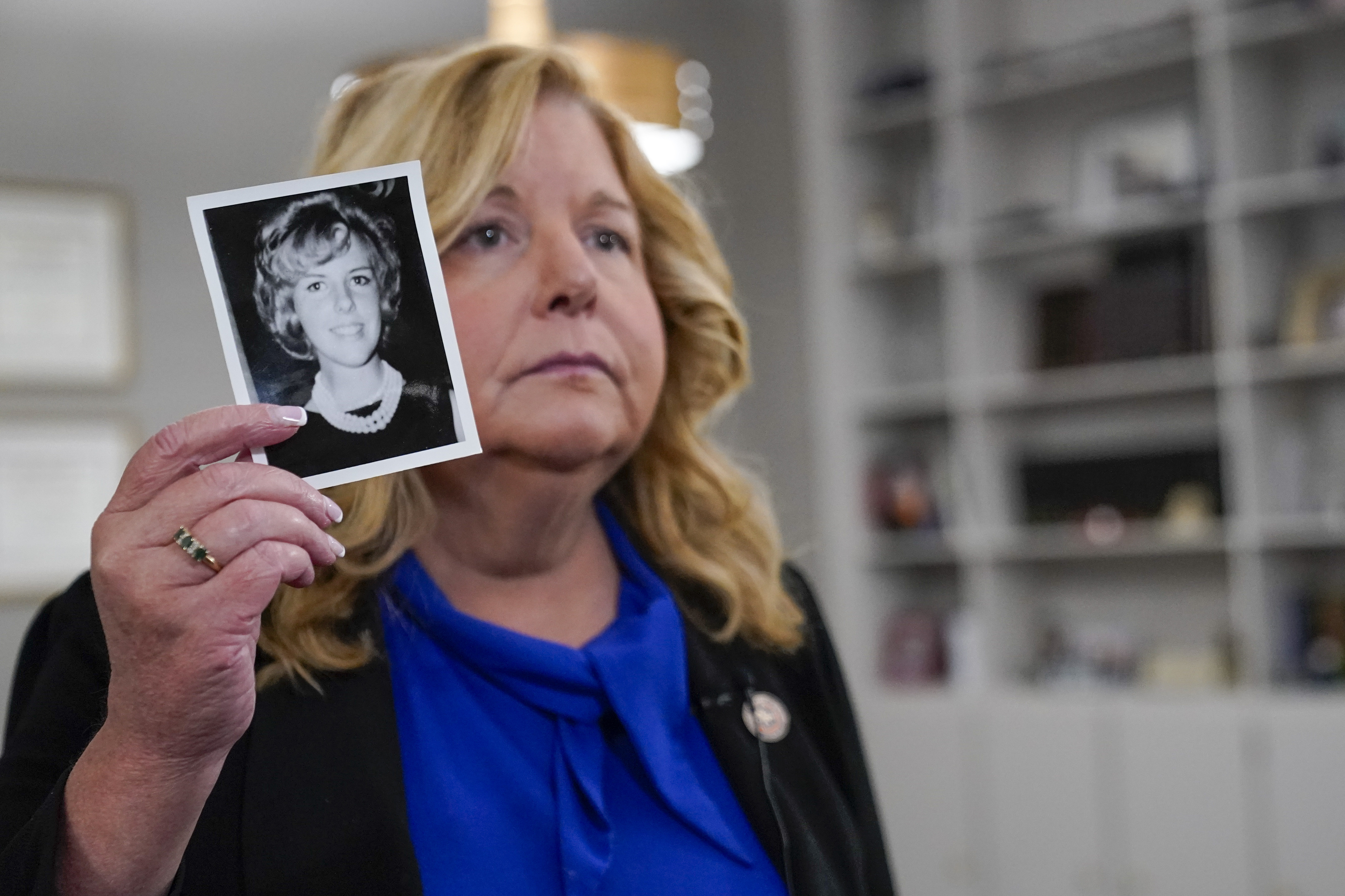 assau County District Attorney Anne Donnelly holds a photo of Diane Cusick during an interview with The Associated Press, Wednesday, June 22, 2022, in Mineola, N.Y. More than 50 years after a woman was found dead in her car at a mall on Long Island, authorities prosecutors are expected to announce that DNA evidence has linked the slaying to Richard Cottingham, a serial killer who has been connected to 11 murders in New York and New Jersey between 1965 and 1980. (AP Photo/Mary Altaffer)