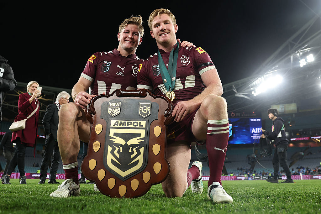 Harry Grant and Tom Dearden of the Maroons celebrate with the State of Origin Shield.