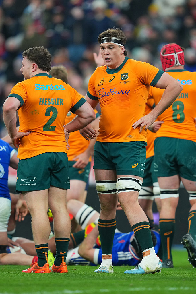 Tom Hooper of Australia interacts with teammate Matt Faessler.