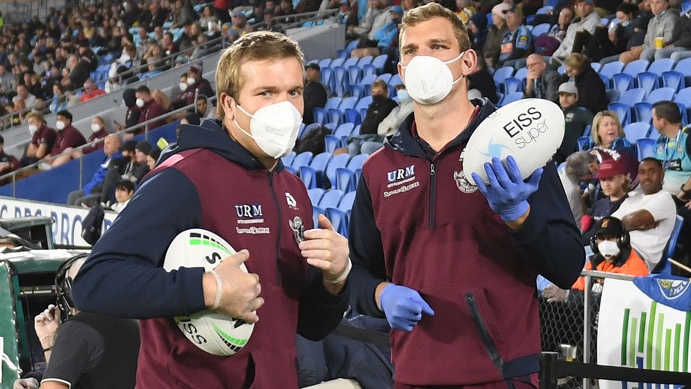 Brothers Jake and Tom Trbojevic act as ball boys during Manly's clash on the weekend. 