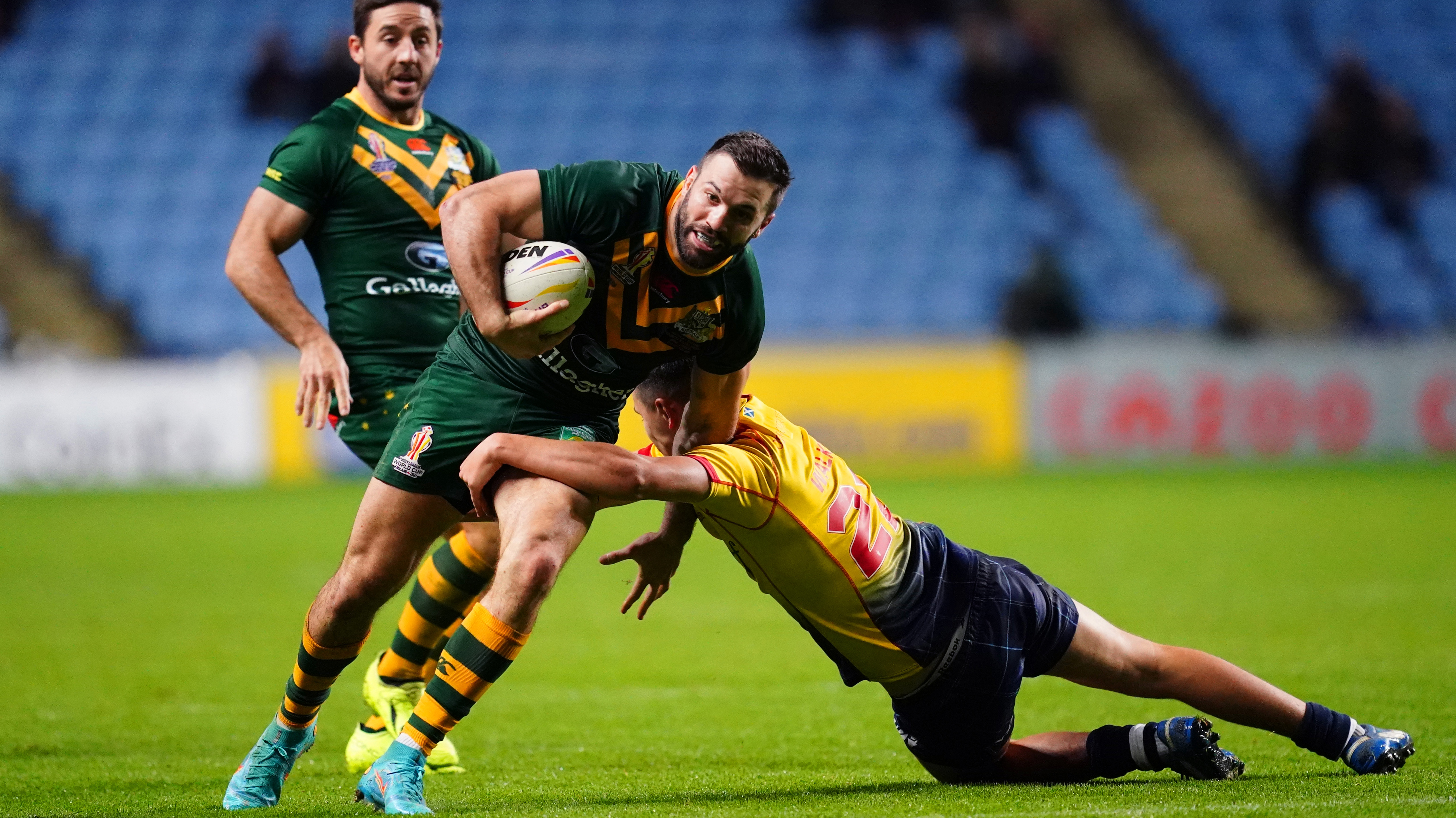 Australia's James Tedesco is tackled by Scotland's Alex Walker during the Rugby League World Cup group B match at the Coventry Building Society Arena, Coventry. Picture date: Friday October 21, 2022. (Photo by David Davies/PA Images via Getty Images)