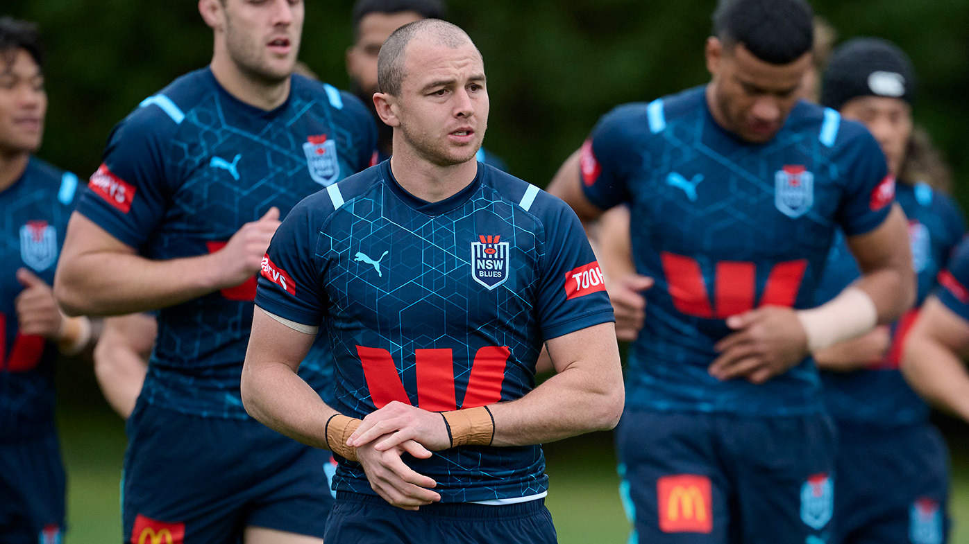 Dylan Edwards warms up with team mates during a New South Wales Blues State of Origin training session at Blue Mountains Grammar School on June 01, 2024 in Katoomba, Australia. (Photo by Brett Hemmings/Getty Images)