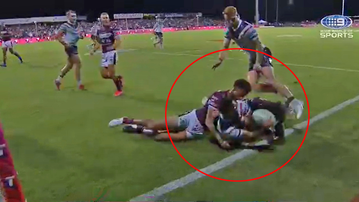 Daniel Tupou is tackled into touch