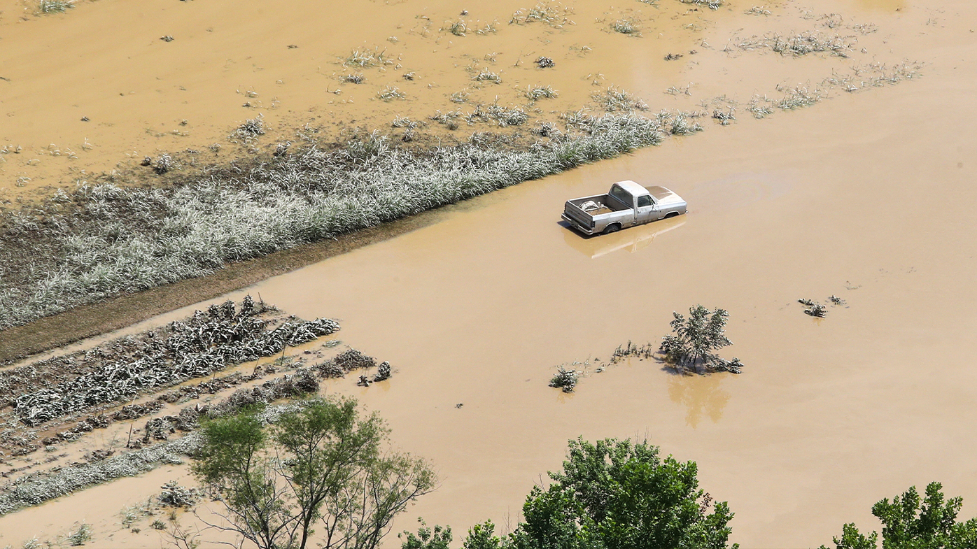 In this aerial photo, some homes in Breathitt County are still surrounded by water on Saturday, July 30, 2022, after historic rains flooded many areas of Eastern Kentucky.