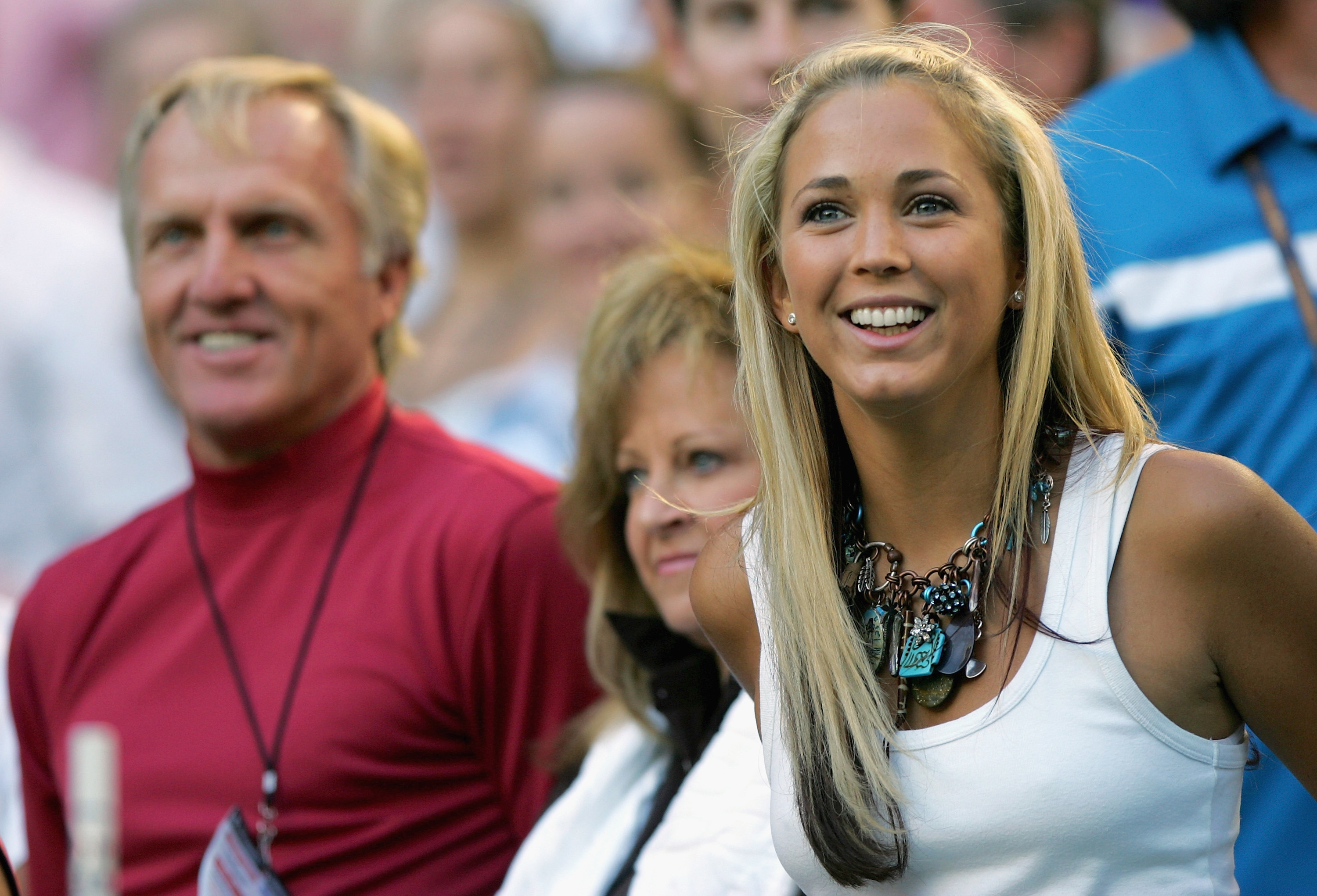 Greg Norman, his wife Laura Norman and Bec Cartright during the pre game entertainment of Lleyton Hewitt playing against Marat Safin during the Men's Final during day 14 of the Australian Open Grand Slam at Melbourne Park January 30, 2005 in Melbourne, Australia.
