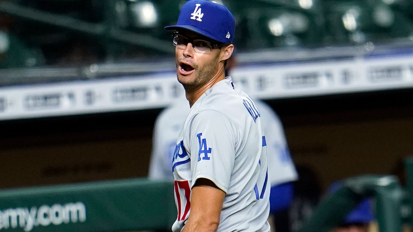 Los Angeles Dodgers relief pitcher Joe Kelly talks toward Houston Astros' Carlos Correa on Tuesday night.