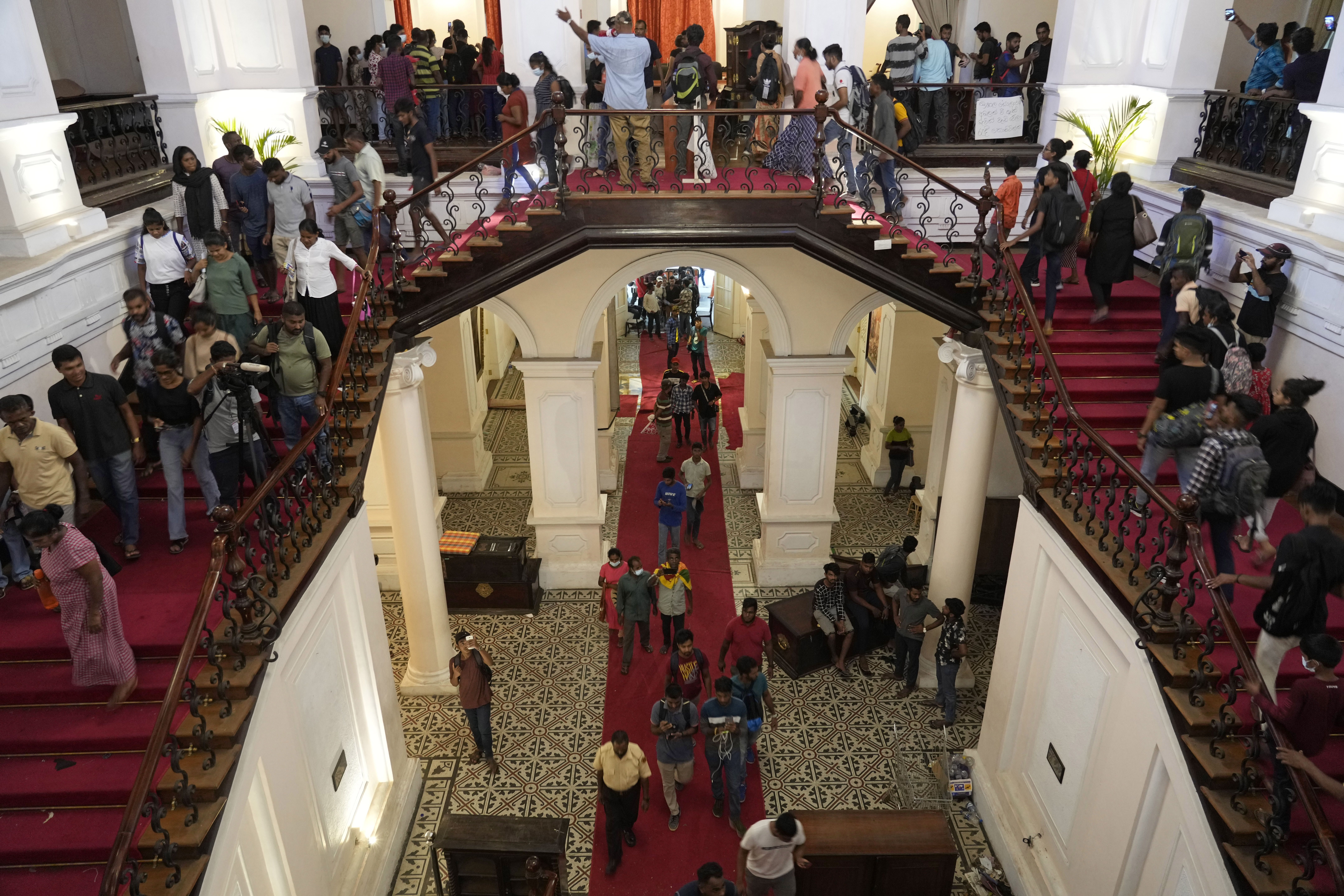 People arrive at the official residence of President Gotabaya Rajapaksa four days after it was stormed by anti-government protesters in Colombo.
