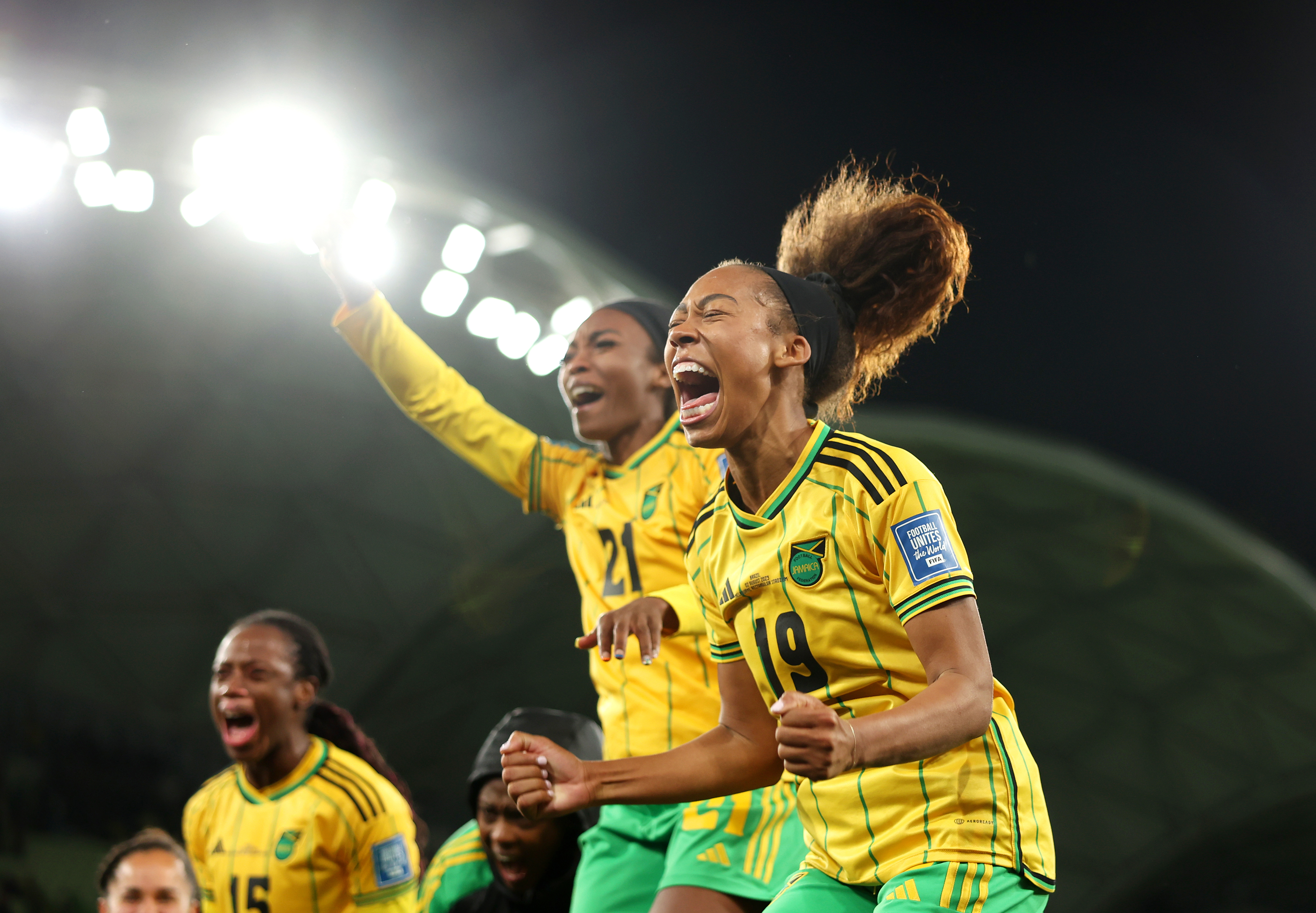 MELBOURNE, AUSTRALIA - AUGUST 02: Tiernny Wiltshire and  Jamaica players celebrate advancing to the knockout stage after the scoreless draw in the FIFA Women's World Cup Australia & New Zealand 2023 Group F match between Jamaica and Brazil at Melbourne Rectangular Stadium on August 02, 2023 in Melbourne, Australia. (Photo by Alex Pantling - FIFA/FIFA via Getty Images)